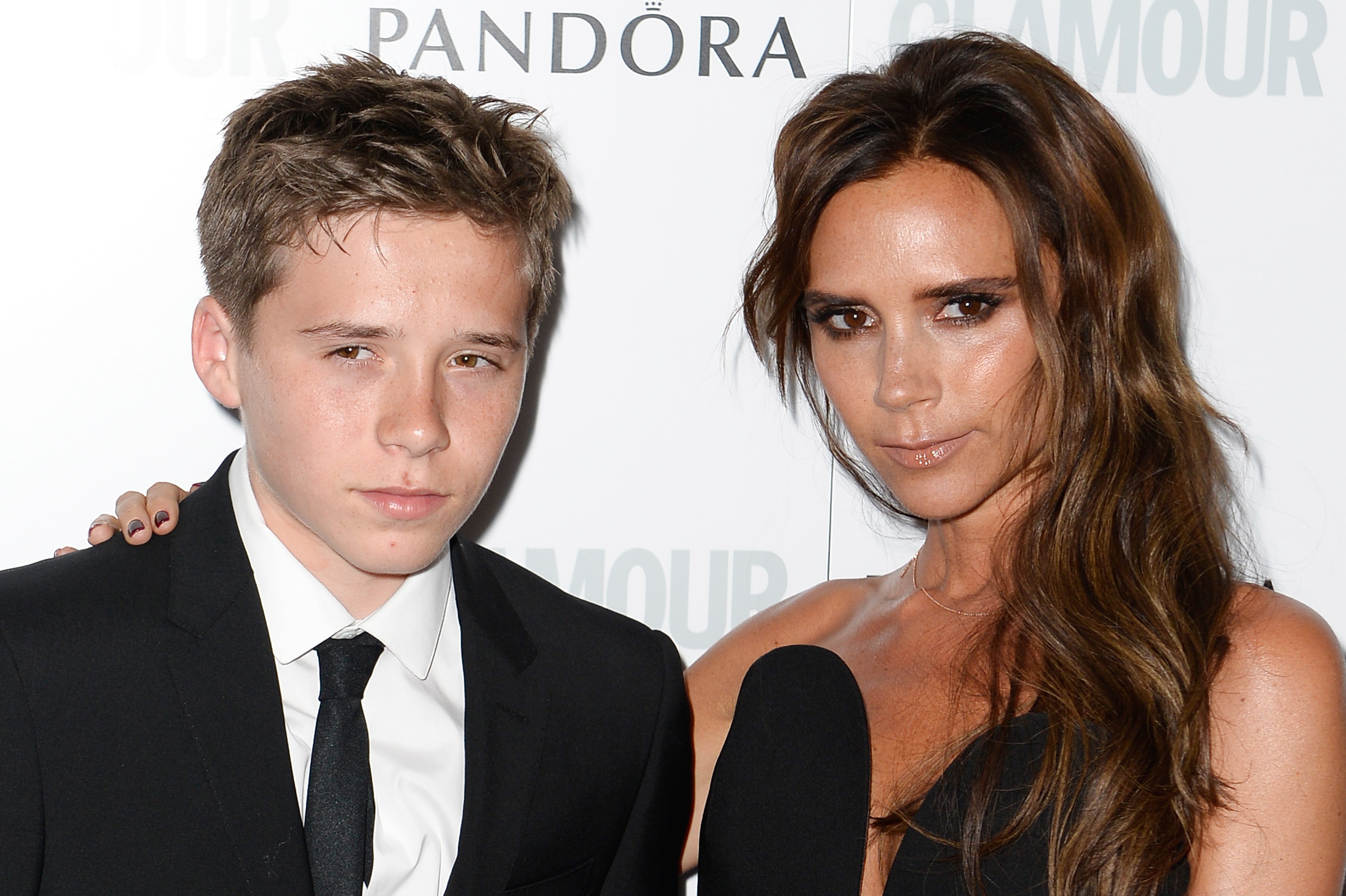 Brooklyn Beckham with his mom, Victoria, in 2013