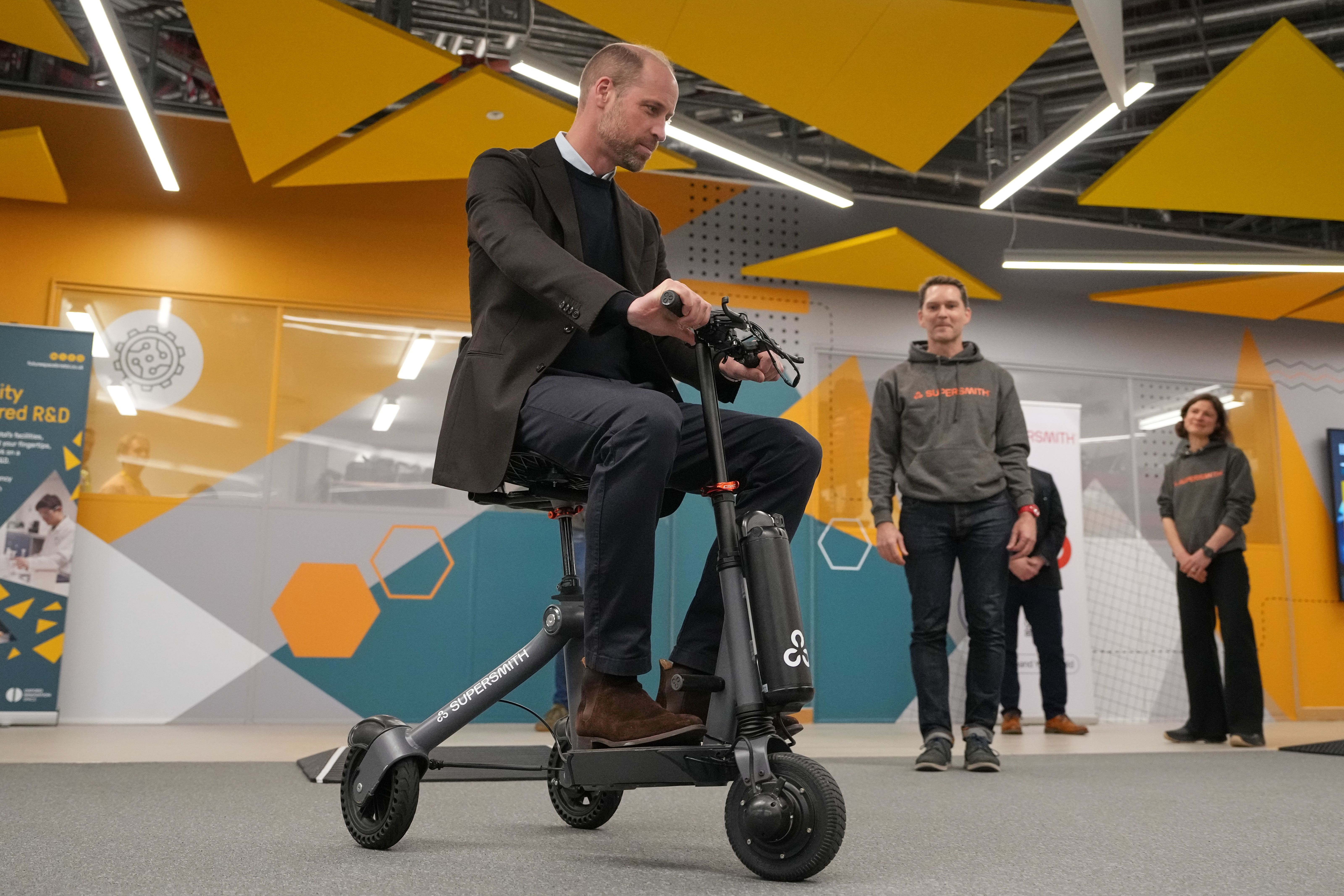 William tries the lightweight mobility scooter during a visit to Bristol Robotics Laboratory (Alastair Grant/PA)
