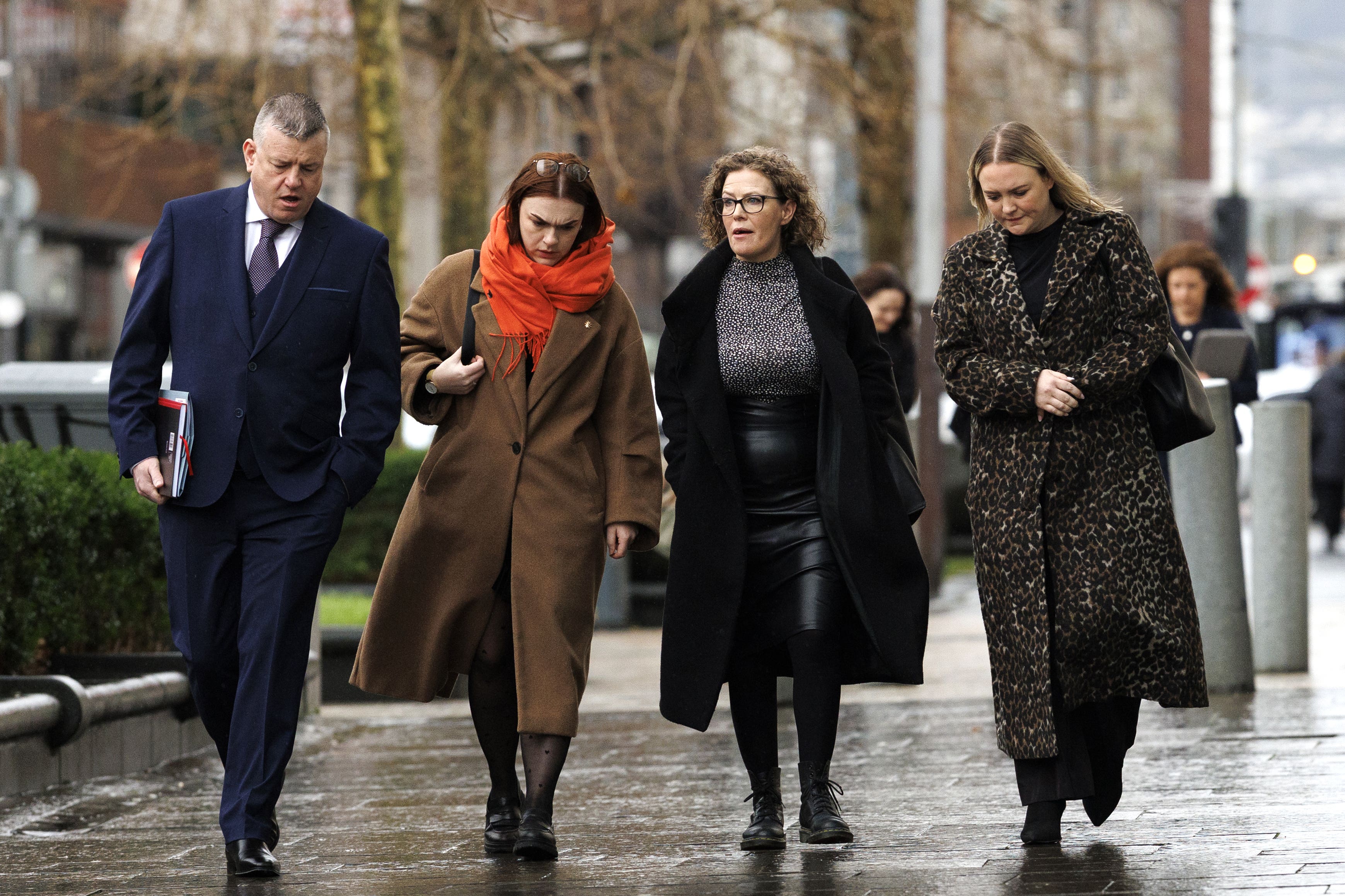 Fiona Donohoe, third left, with her family and solicitor outside the court (Liam McBurney/PA)