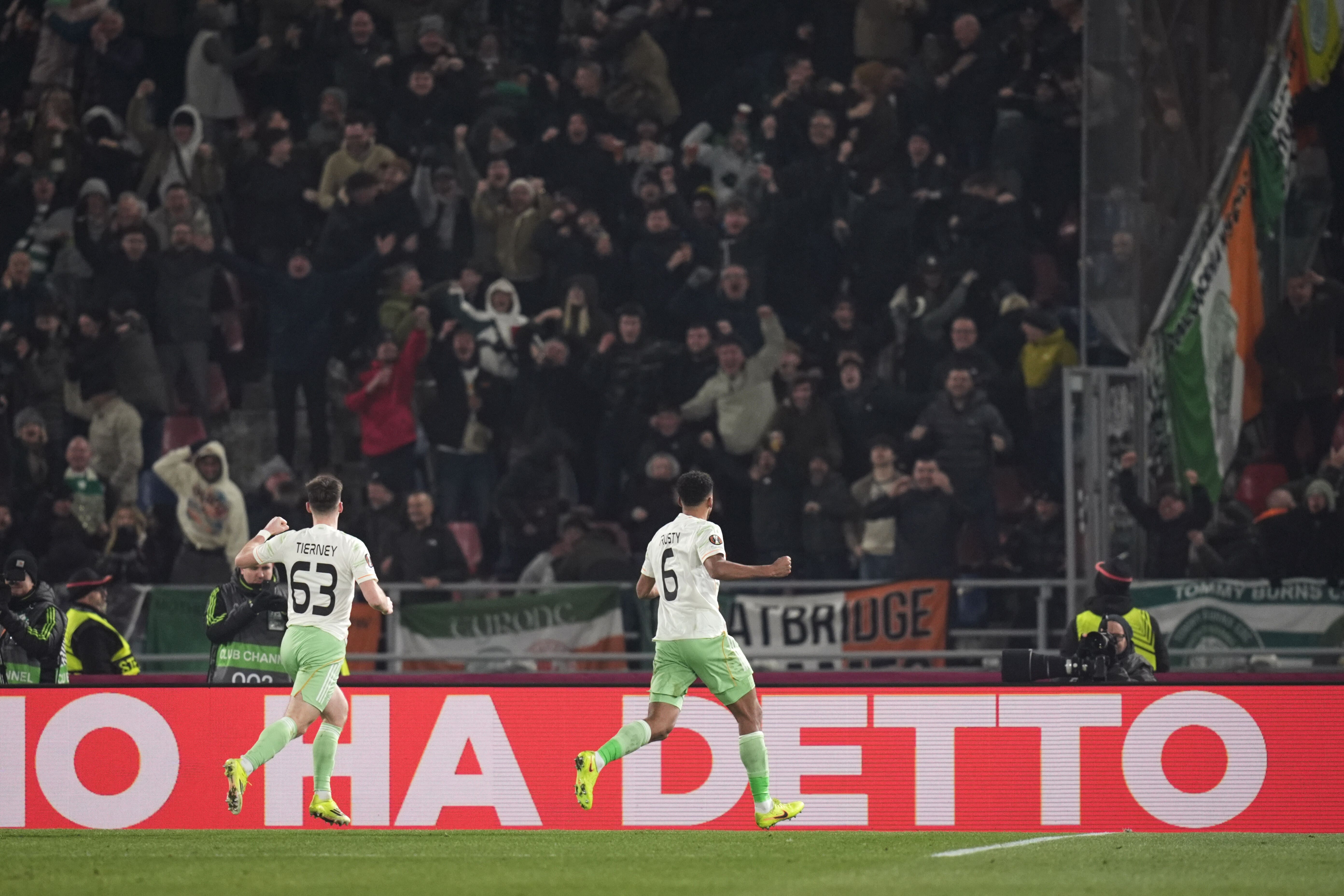 Auston Trusty, right, celebrates his goal in front of the Celtic fans (Massimo Paolone/LaPresse via AP)
