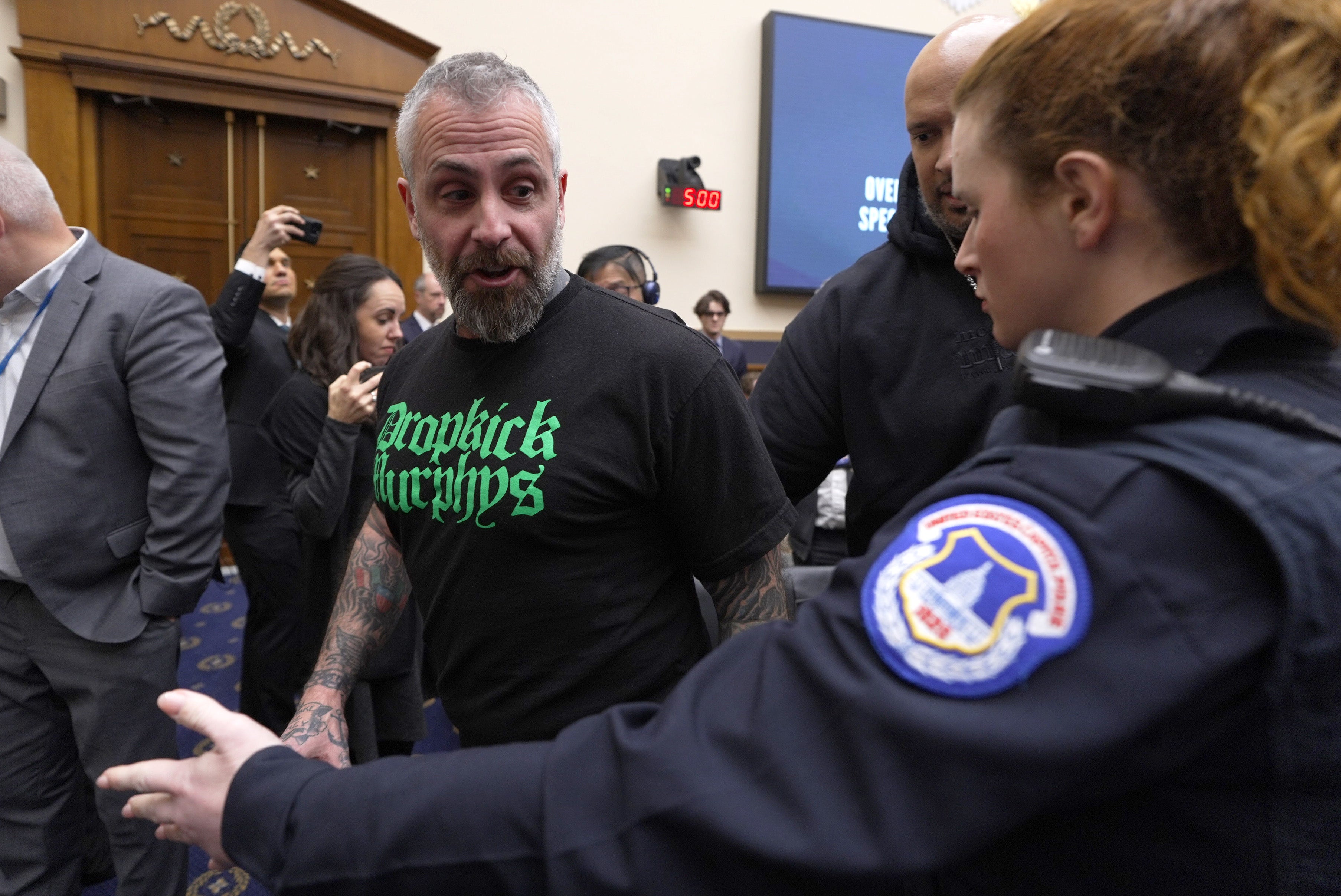 Fanone, who was among law enforcement officers beaten by Jan 6 rioters, said Raiklin had threatened his family