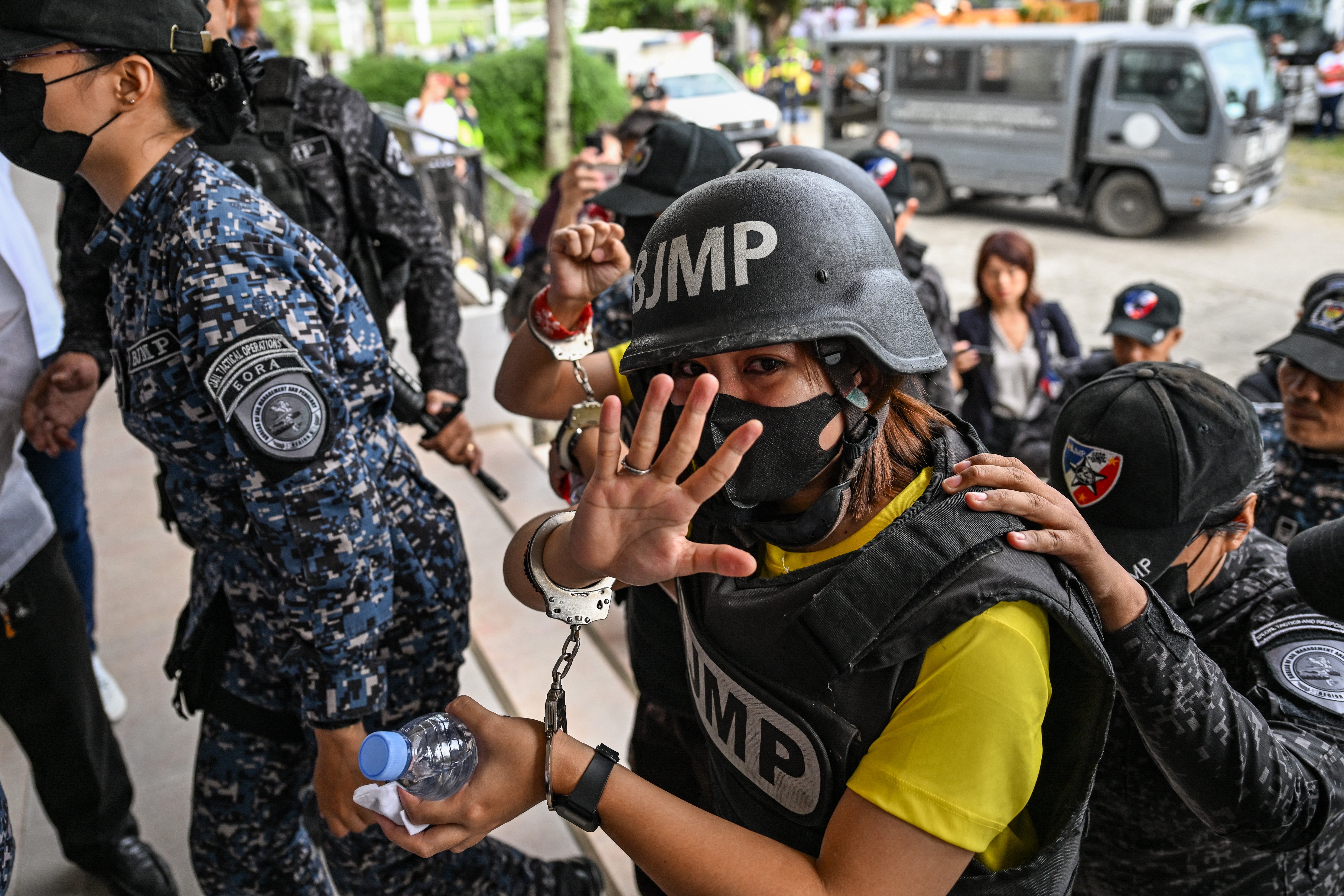 Frenchie Mae Cumpio, a detained Filipino journalist, gestures as she arrives at Tacloban Regional Trial Court in Leyte island on 22 January 2026, to attend the promulgation of her court case. - Cumpio, a young Philippine journalist who spent nearly six years in a crowded provincial prison, was found guilty of terror financing on 22 January in a case rights groups and a UN rapporteur had labelled a ‘travesty of justice’