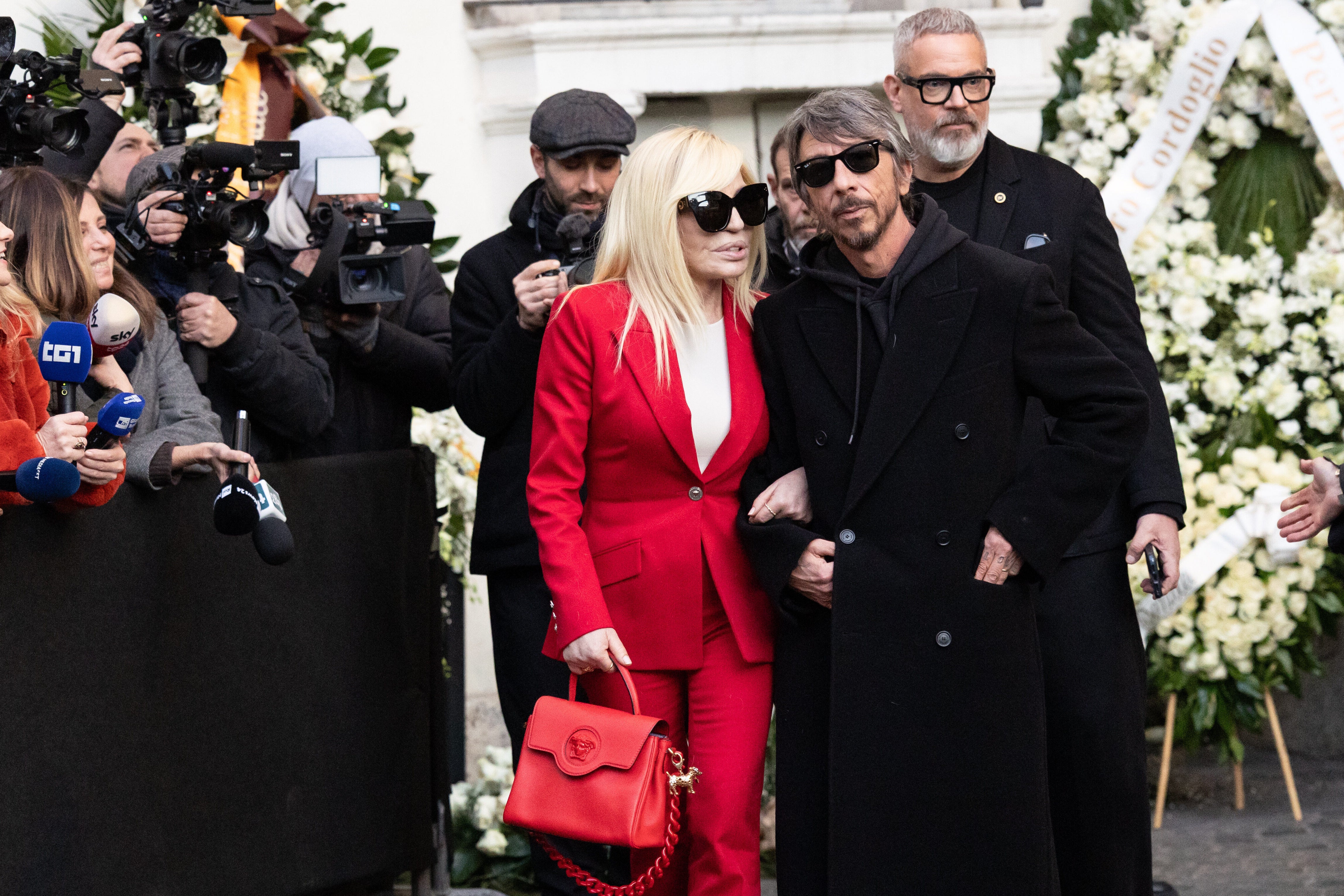 Donatella Versace, and former creative director of Valentino Pierpaolo Piccioli, right, arrive at the funeral of fashion designer Valentino Garavani in central Rome