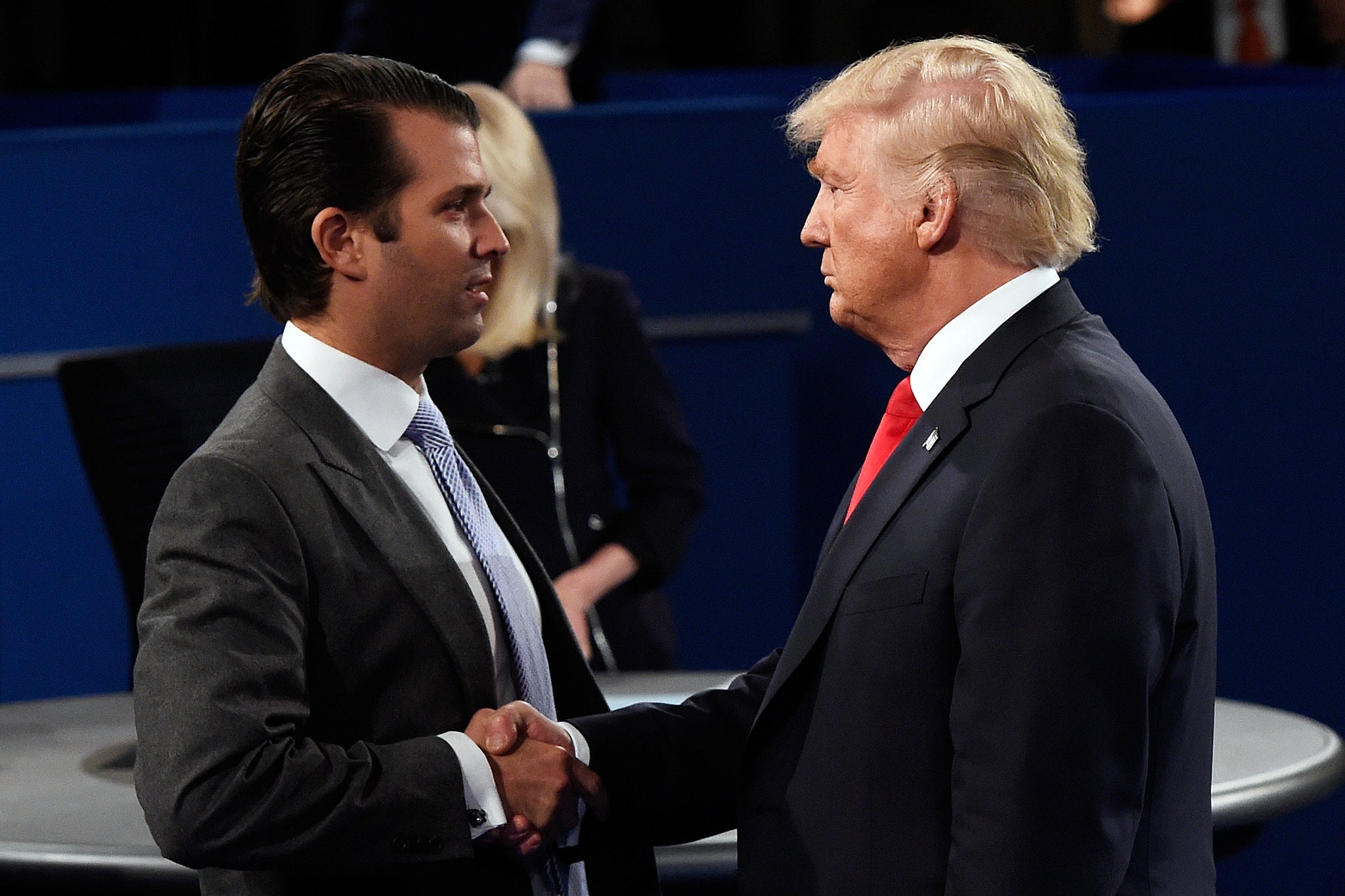Donald Trump, Jr greets his father at Washington University on 9 October 2016 in St Louis, Missouri