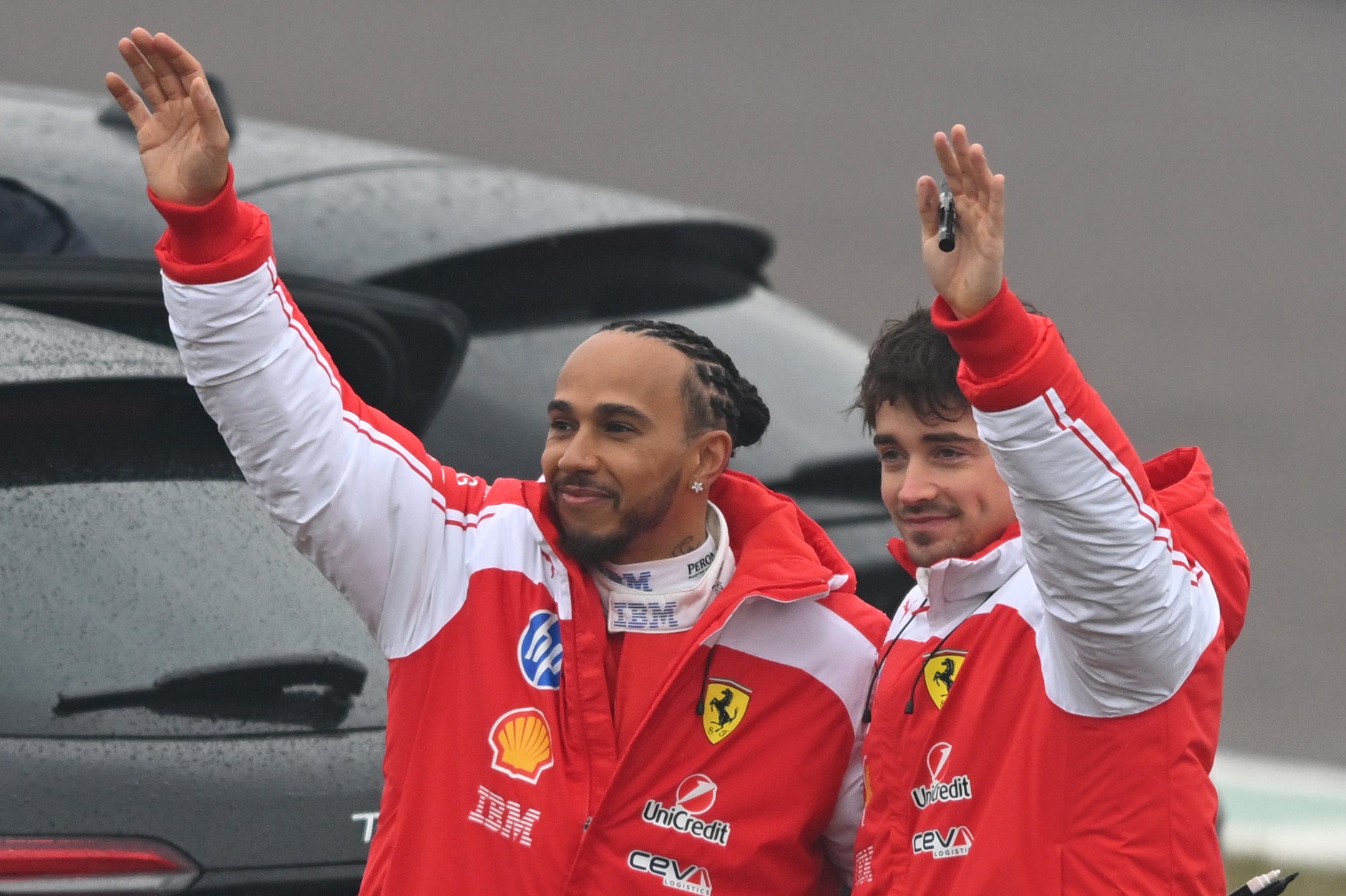 Hamilton and Charles Leclerc wave to the crowd in Fiorano on Friday