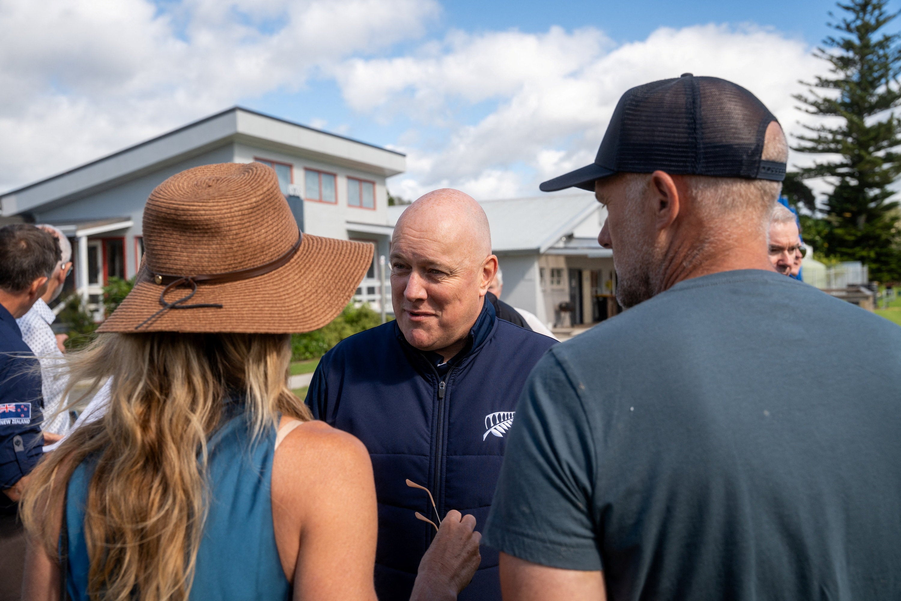 New Zealand’s prime minister Christopher Luxon speaks with residents to assess the damage after the landslide