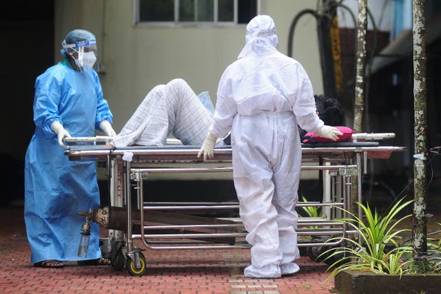 <p>Healthcare workers shift a patient with symptoms of Nipah infection to an isolation ward at a hospital in Kerala, September 2023</p>