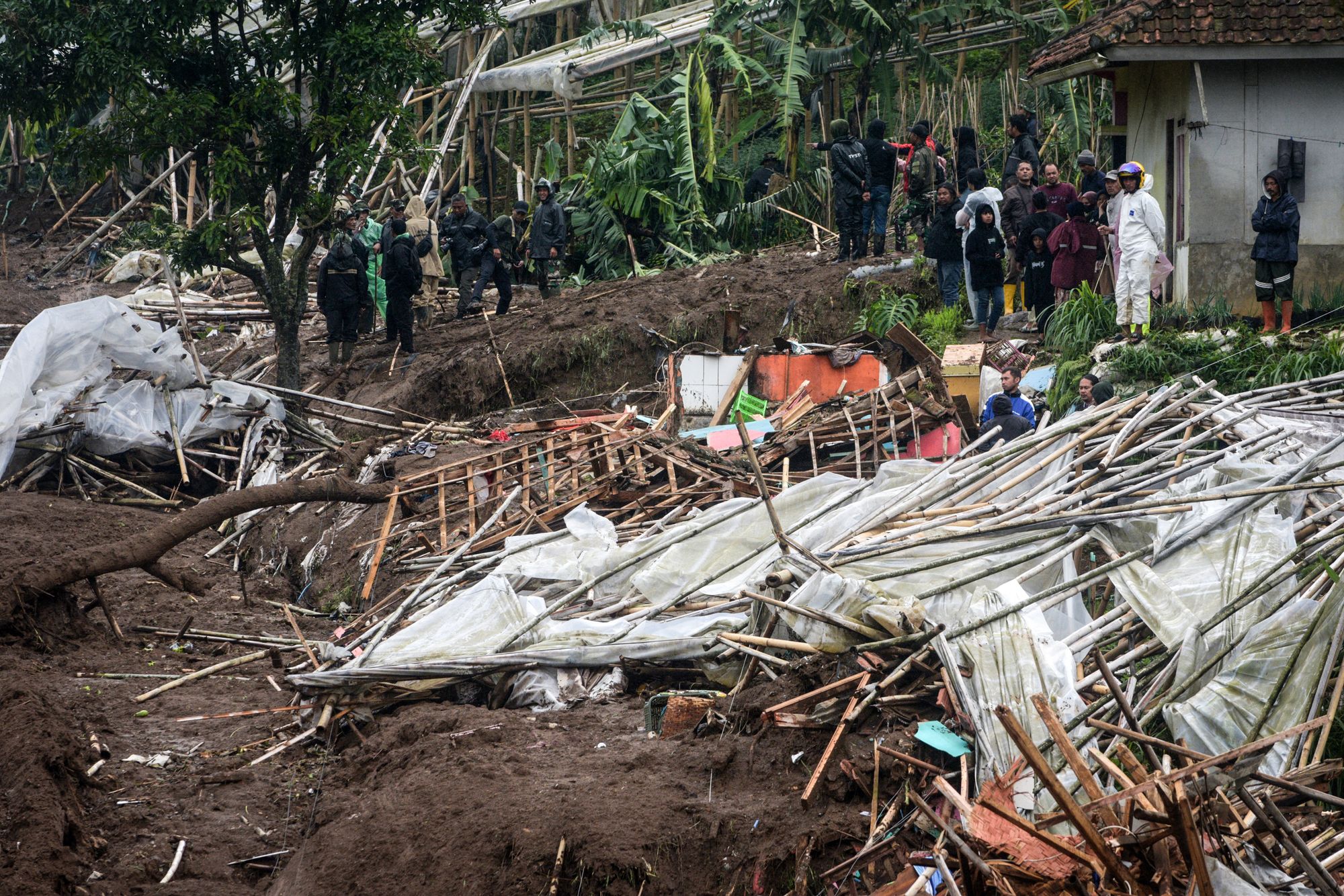 <p>Rescuers search for victims buried by a landslide in Indonesia’s West Java province on Saturday </p>
