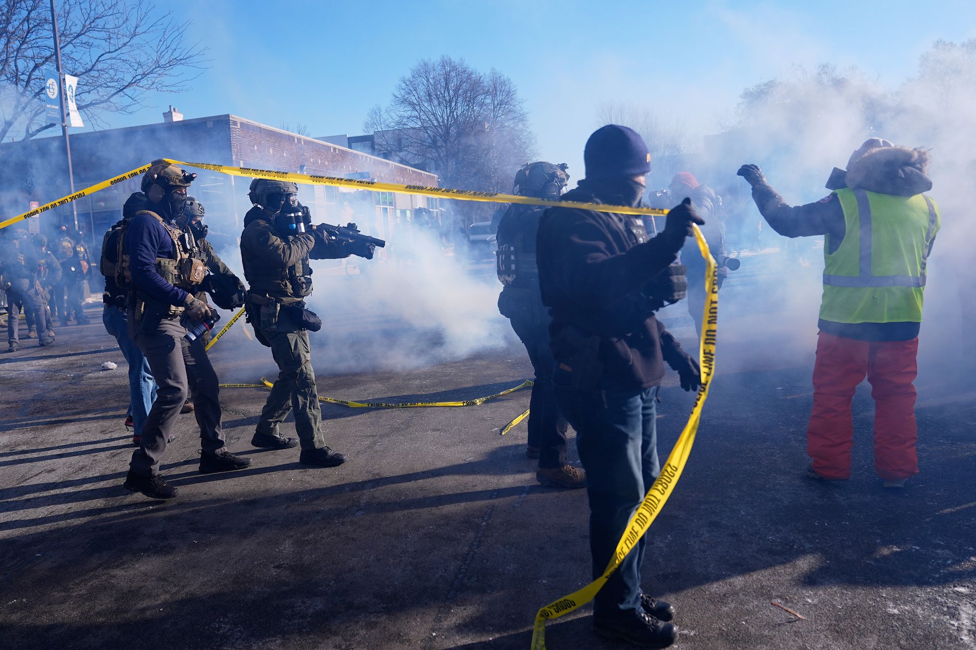 Federal immigration officers deploy tear gas at protesters after Pretti’s shooting