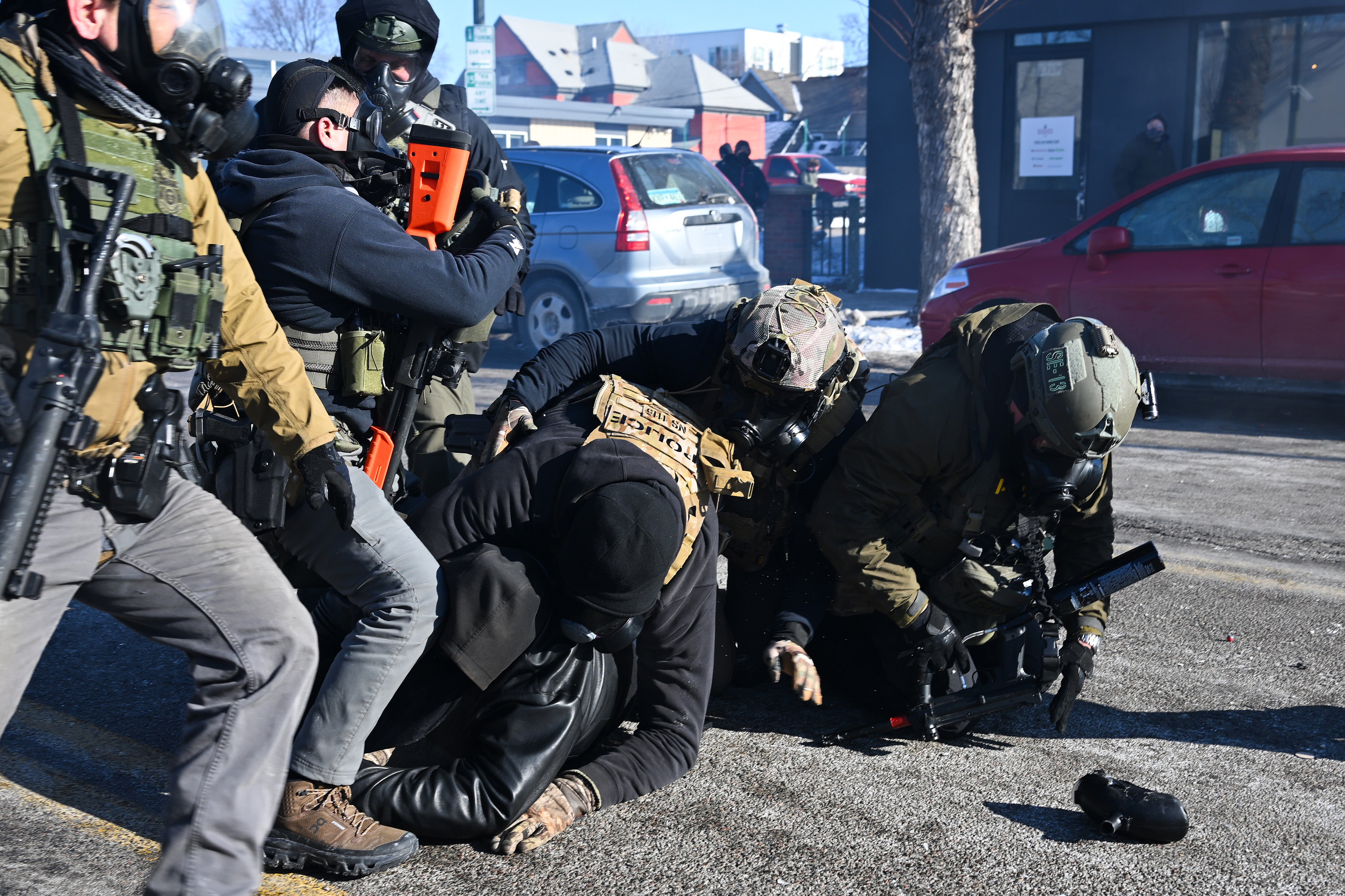 A person is tackled by federal agents amid protests following the shooting of ICU nurse Alex Pretti, who was recording a Border Patrol operation on January 24, 2026.