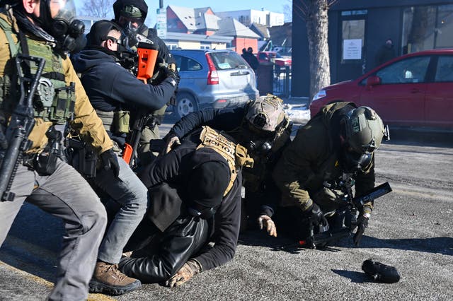 <p>A person is tackled by federal agents amid protests following a shooting on January 24, 2026 in Minneapolis, Minnesota. Federal agents allegedly shot and killed a protestor amid a scuffle to arrest him</p>