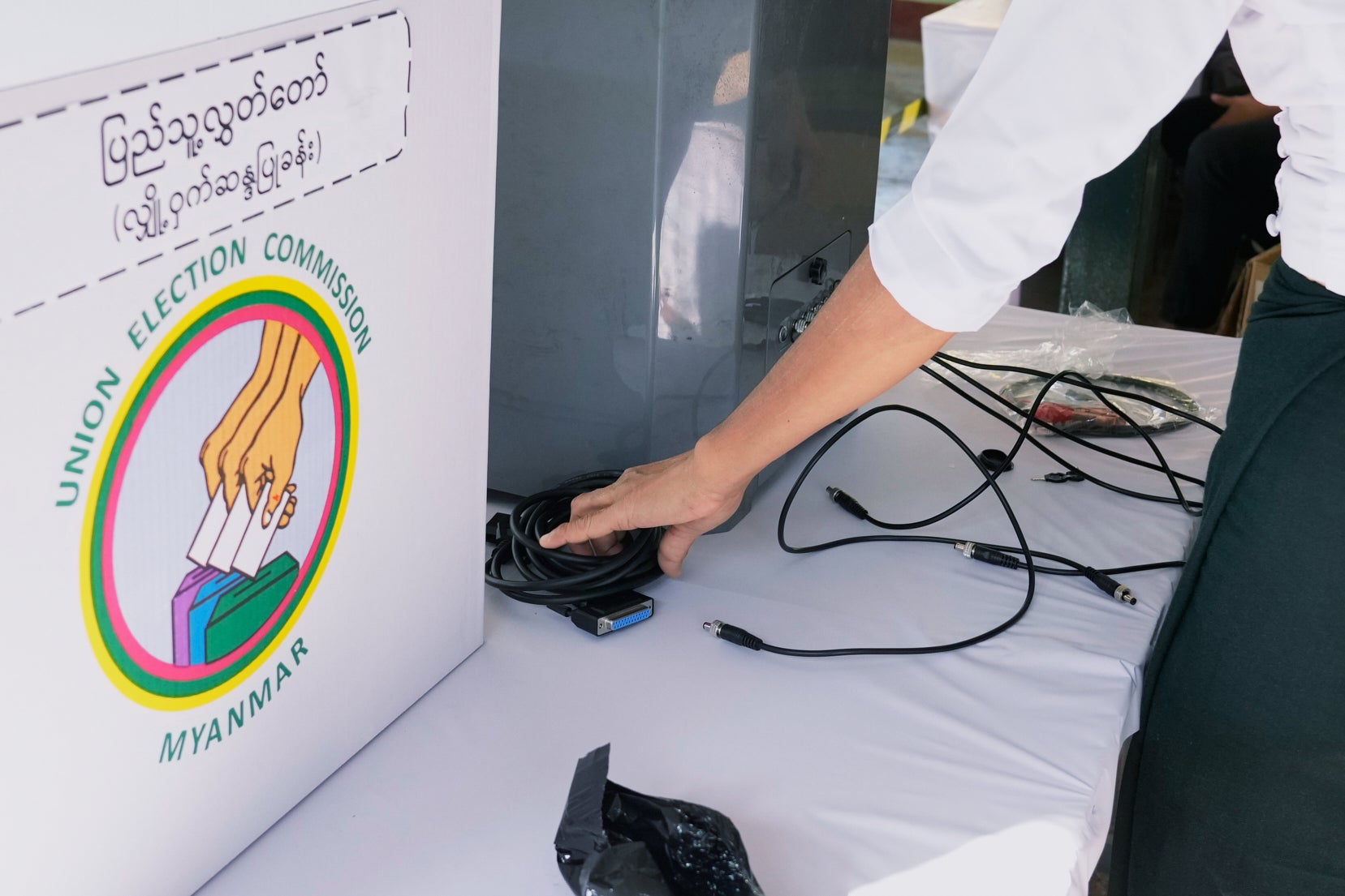 <p>An Election Commission official sets up an electronic voting machine at a polling station in Yangon, Myanmar</p>