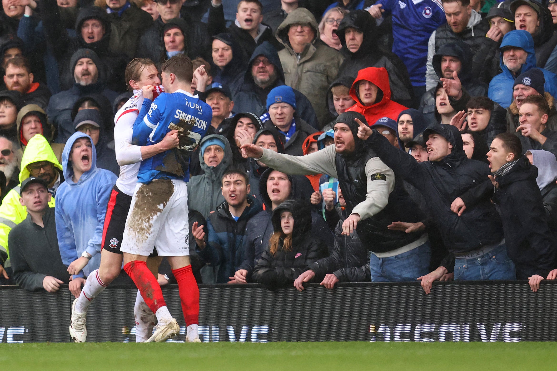Flynn Downes and Zak Swanson clashed at Fratton Park