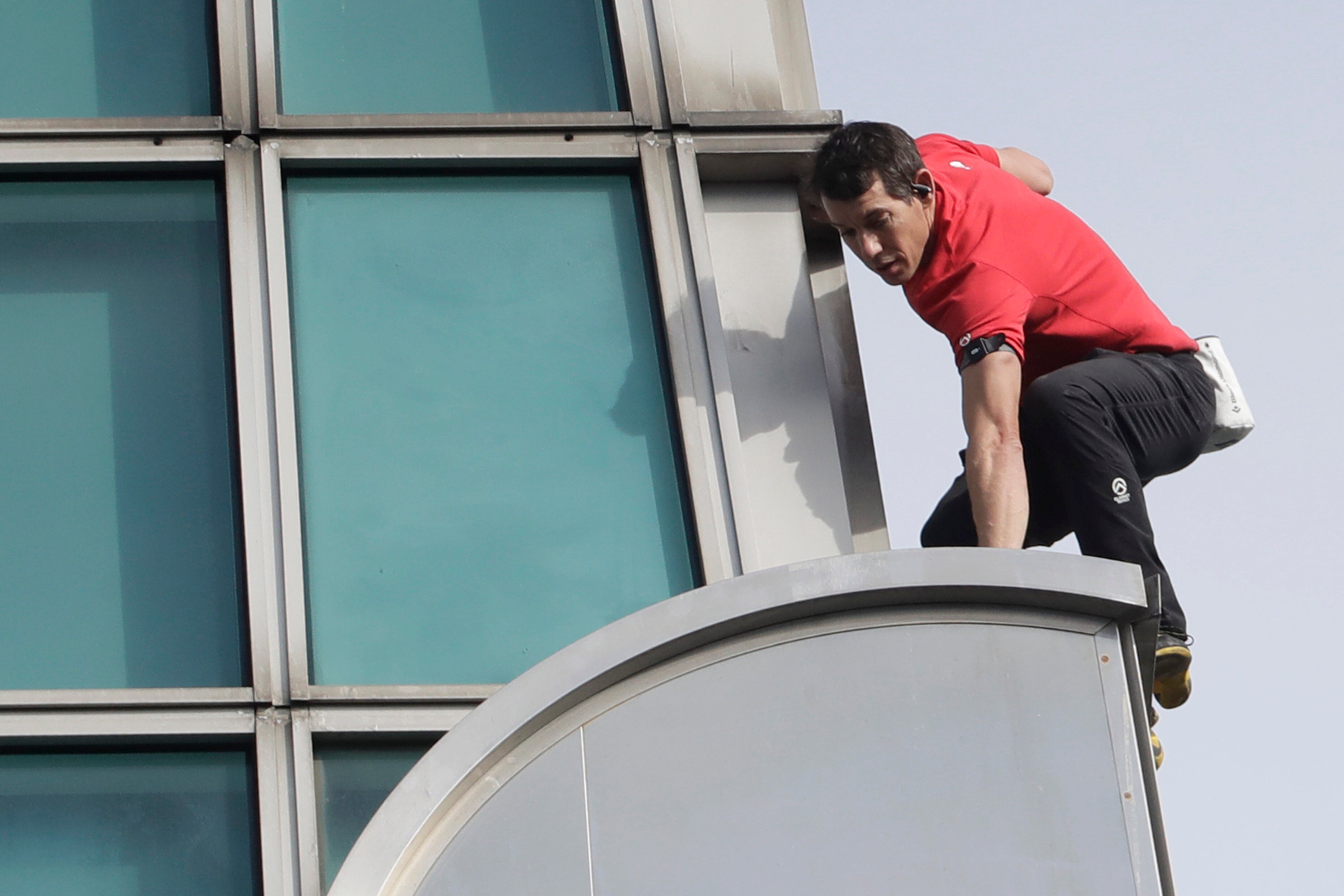Rock climber Alex Honnold, of the US performs a free solo climb of the Taipei 101 skyscraper in Taipei, Taiwan, Sunday