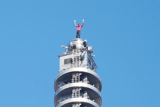 <p>US rock climber Alex Honnold raises his arms from the top of the Taipei 101 building after he successfully free soloed the landmark skyscraper without ropes or safety gear in Taipei on 25 January 2026</p>