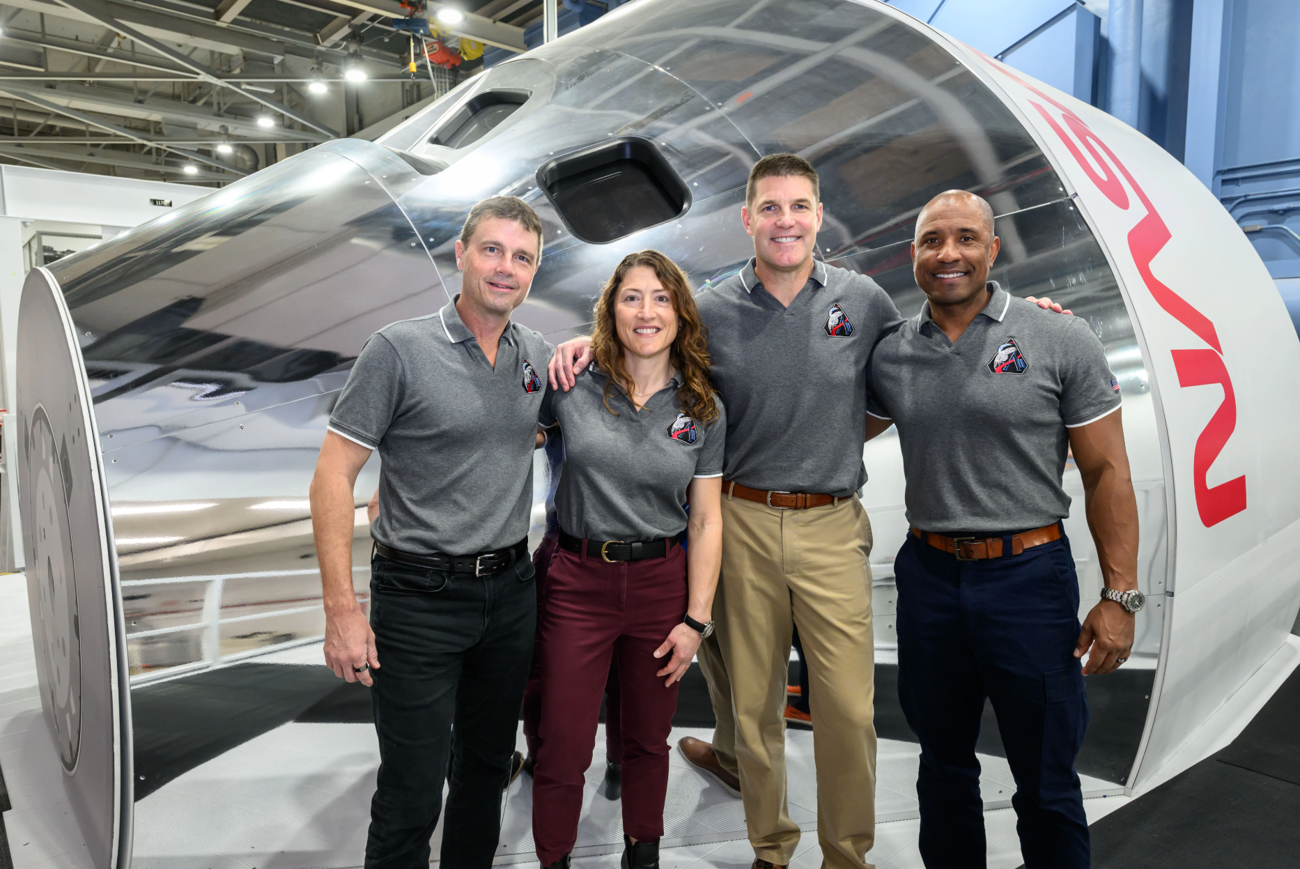 The four Nasa astronauts of the Artemis II crew pose in front of an Orion simulator on 23 January at the Johnson Space Center in Houston, Texas
