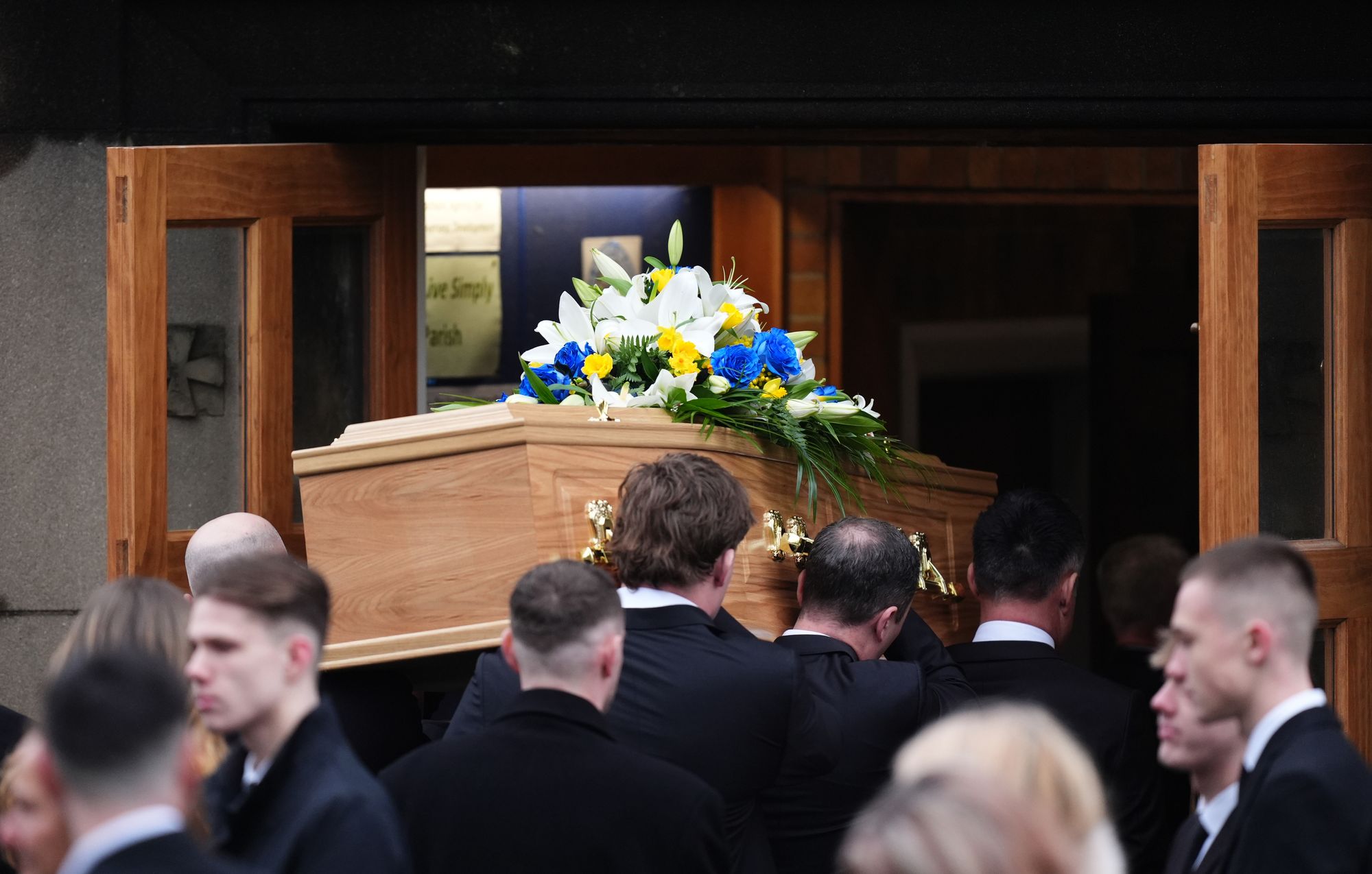 Terry Yorath’s coffin is carried into church
