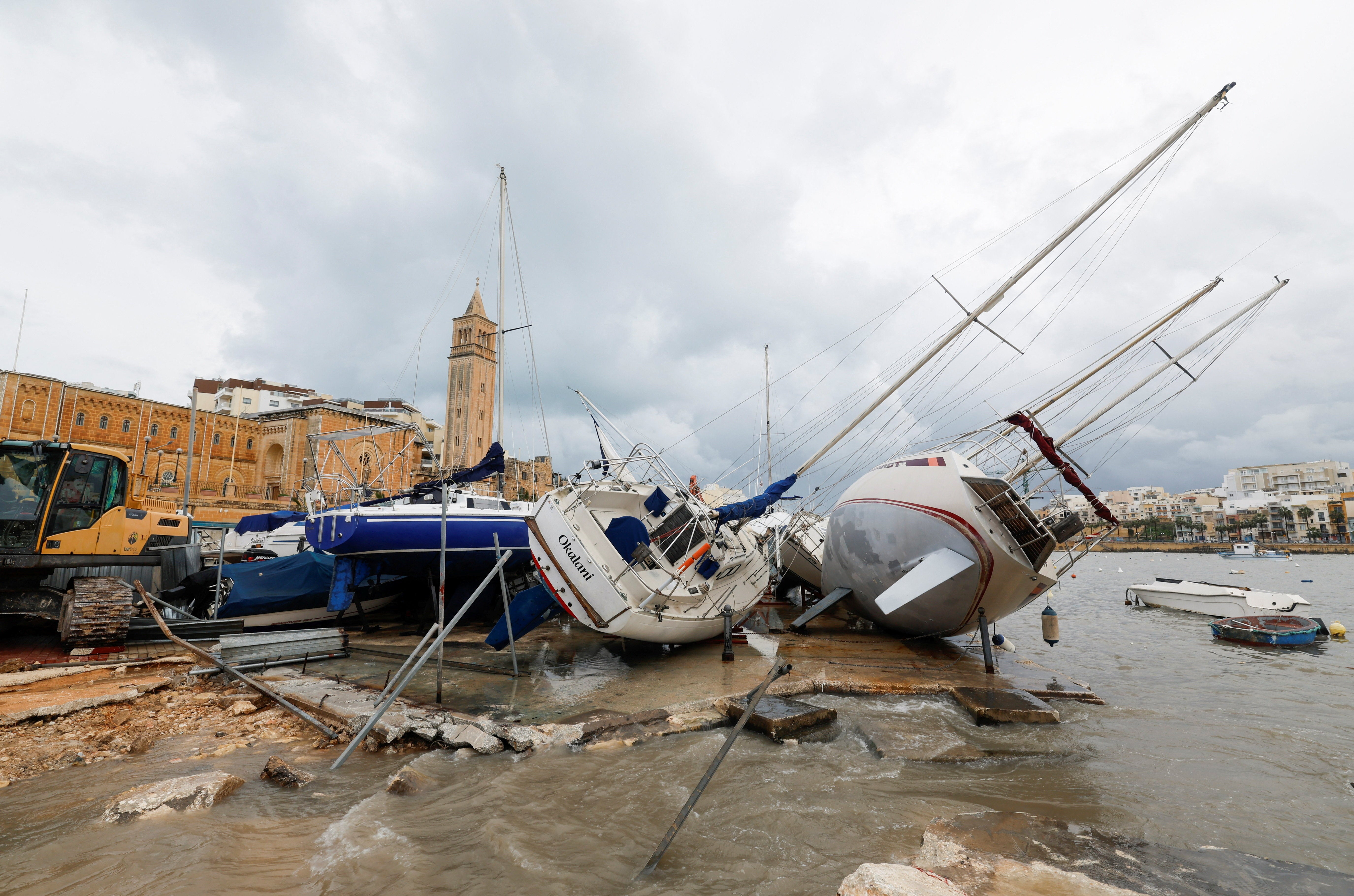 Yachts which were toppled over by high winds and waves lie in a boatyard, after the area was heavily hit by Storm Harry, in Marsascala, Malta