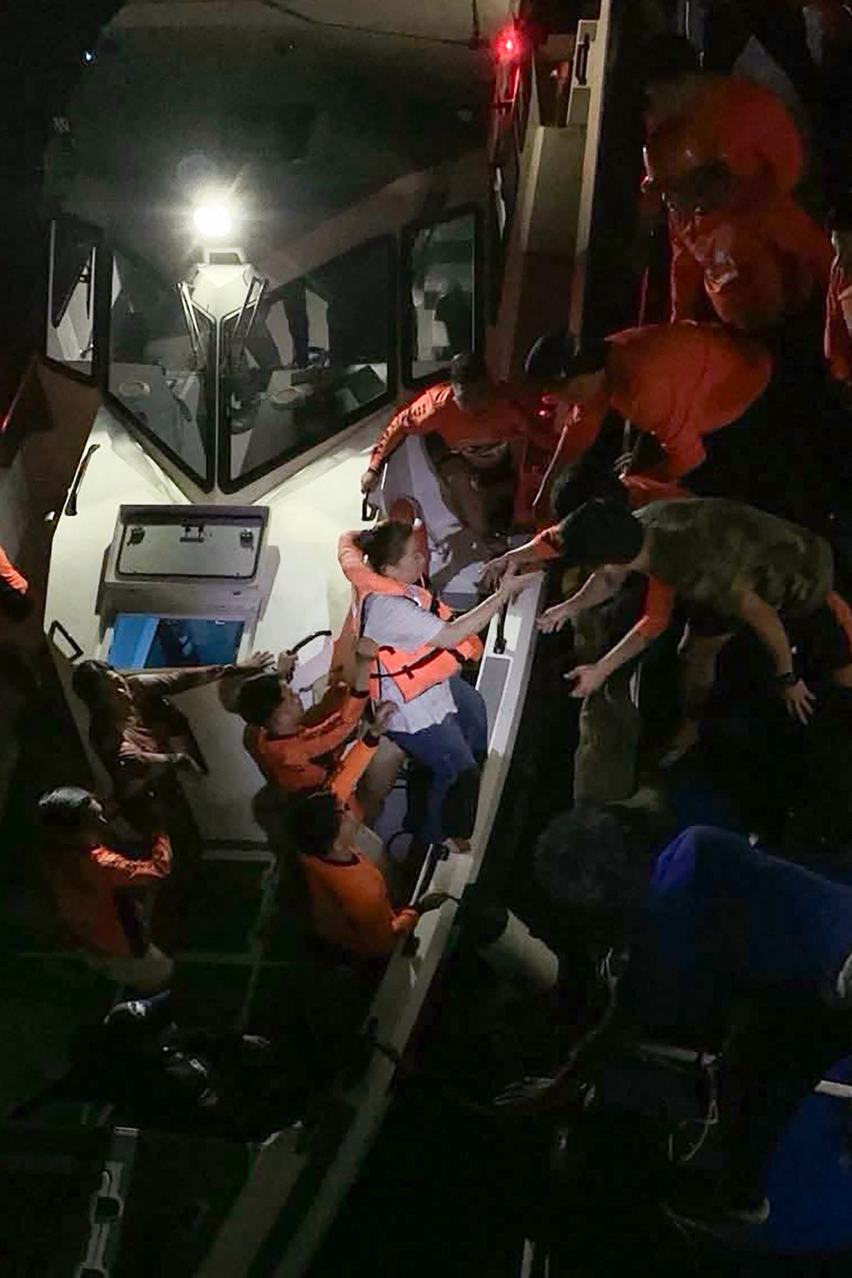 Survivors of the sunken MV Trisha Kerstin 3 being transferred to another ship