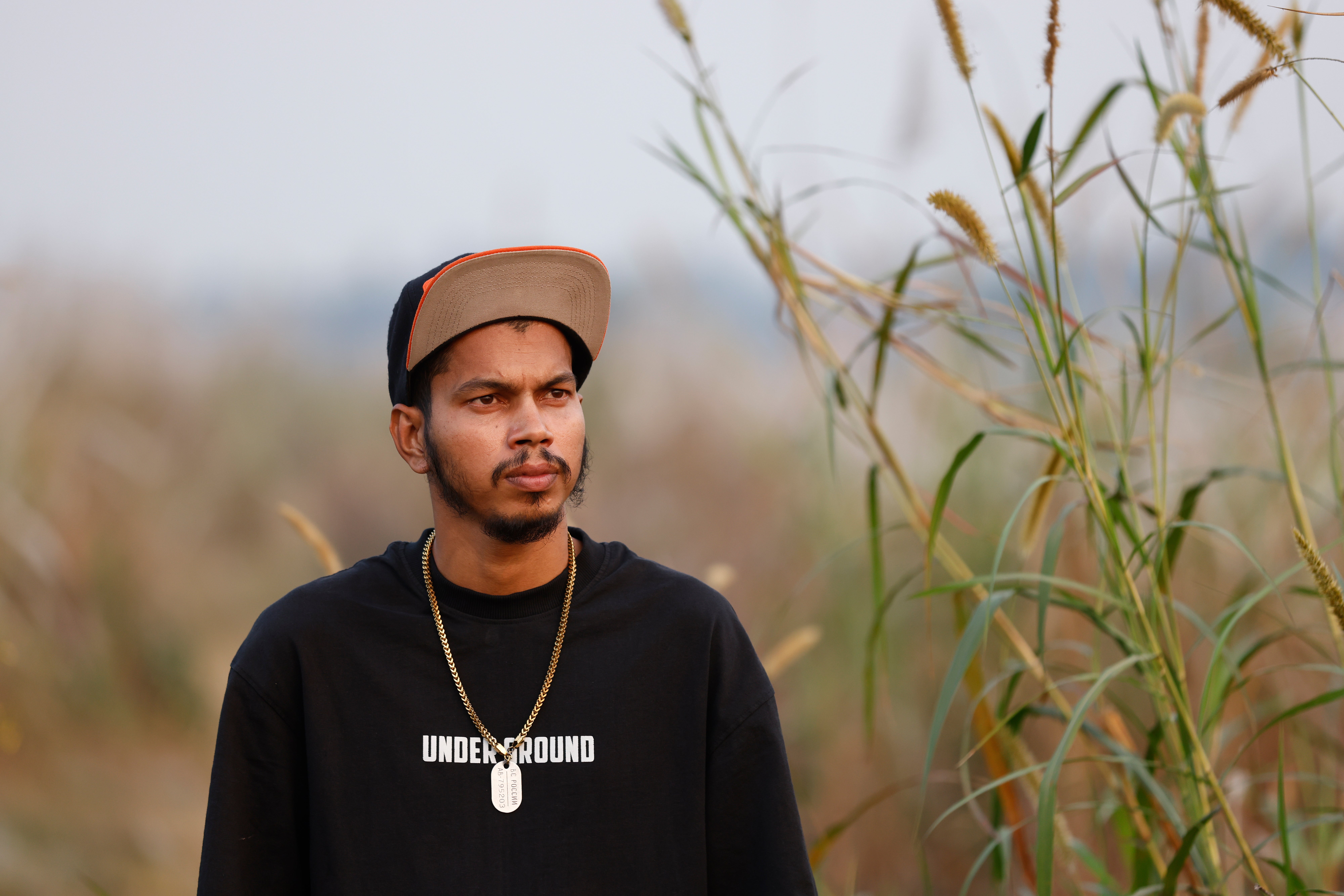 Mohan Miajee, 29, who escaped after fighting for the Russian army, poses for a portrait in Munshiganj, Bangladesh, Dec. 9, 2025. (AP Photo/Rajib Dhar)