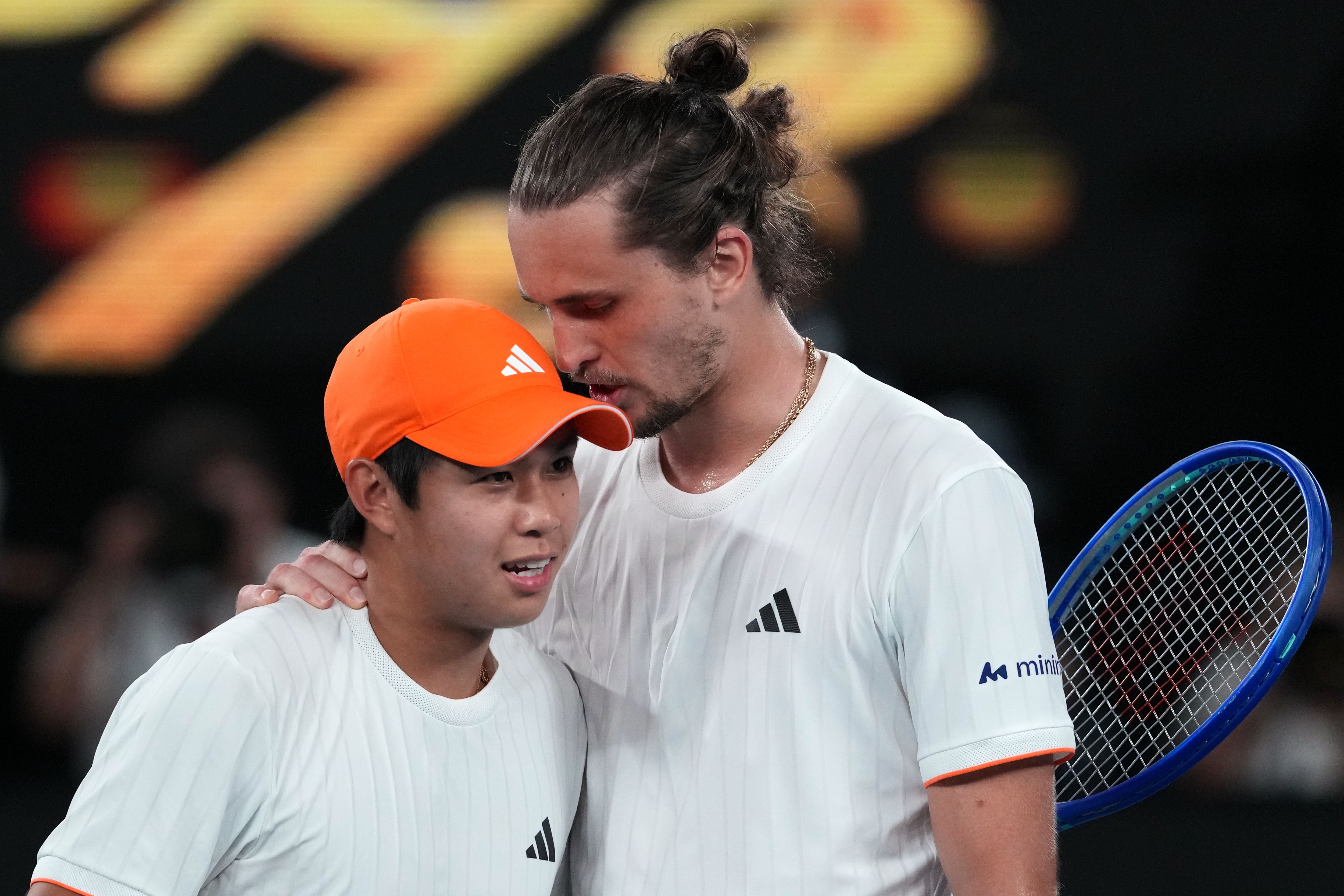 Alexander Zverev, right, heaped praise on Tien after their match (Aaron Favila/AP)