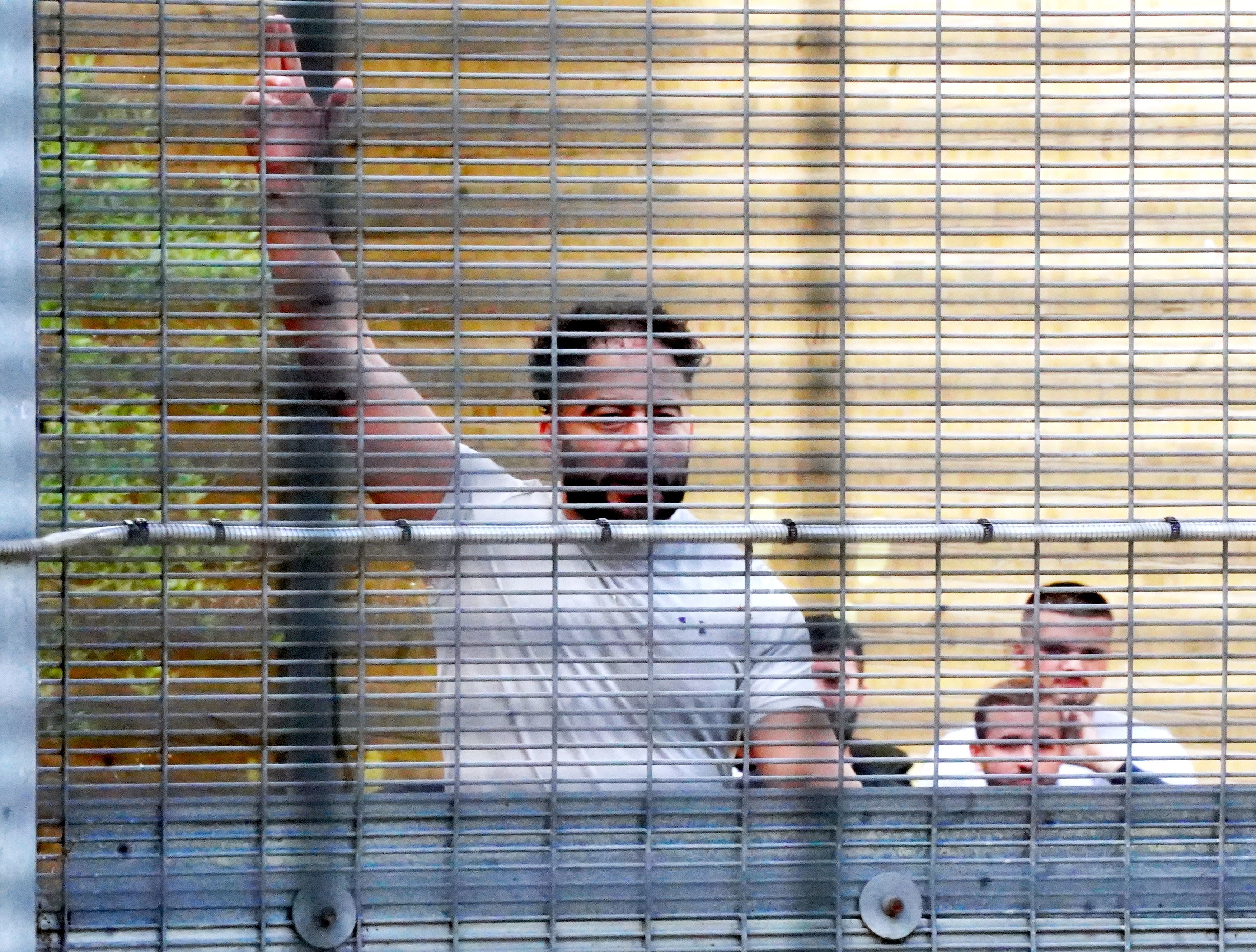 People held at Brook House immigration removal centre respond to demonstrators from migrant rights groups in 2022