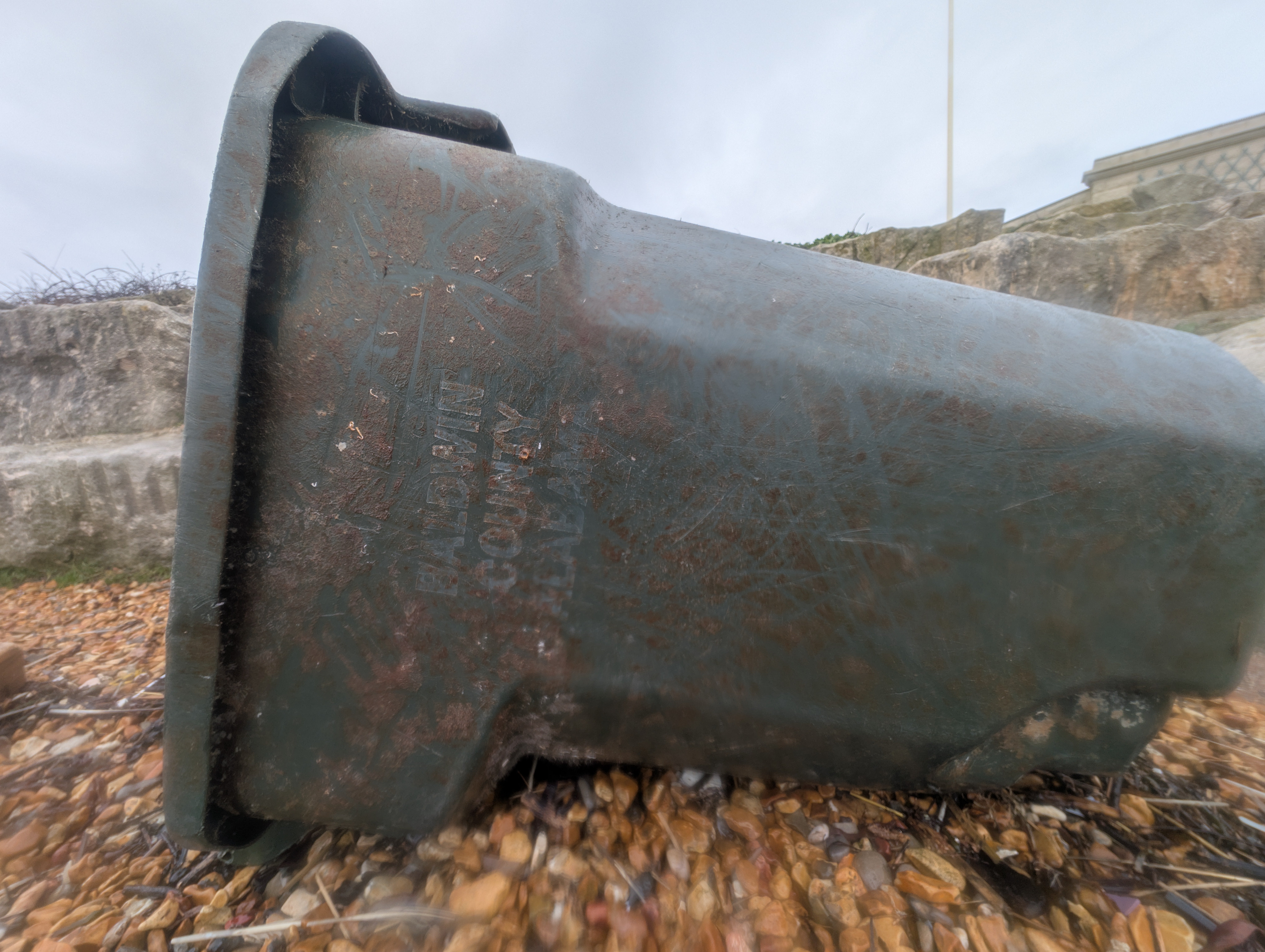 The black bin has writing on the side which stated 'Baldwin County, Alabama’