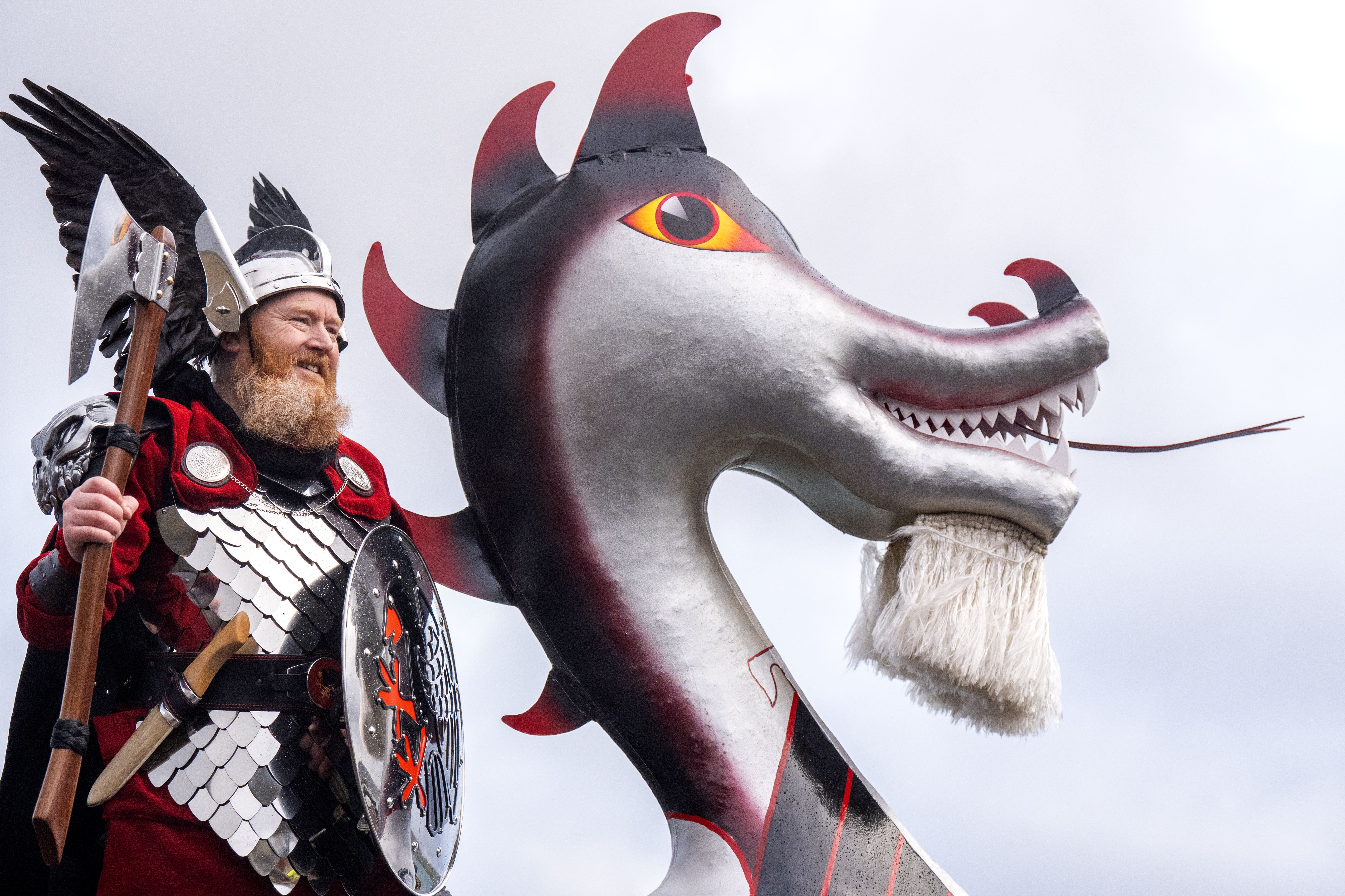 Lynden Nicolson, the Guizer Jarl of the Jarl Squad, on the galley at the harbour in Lerwick on the Shetland Isles during the Up Helly Aa festival (Jane Barlow/PA)