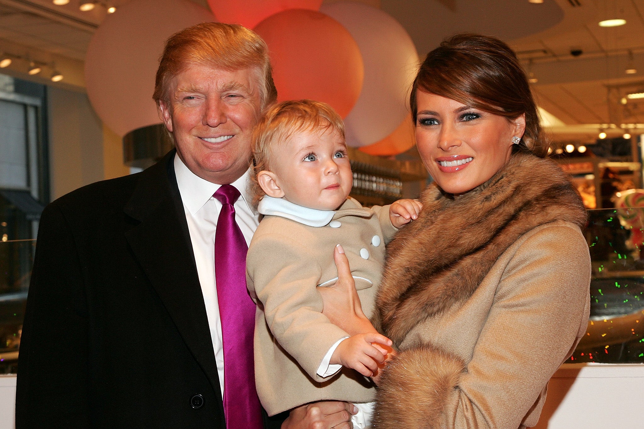 All smiles: Donald Trump, his wife Melania Trump and their son Barron in 2007