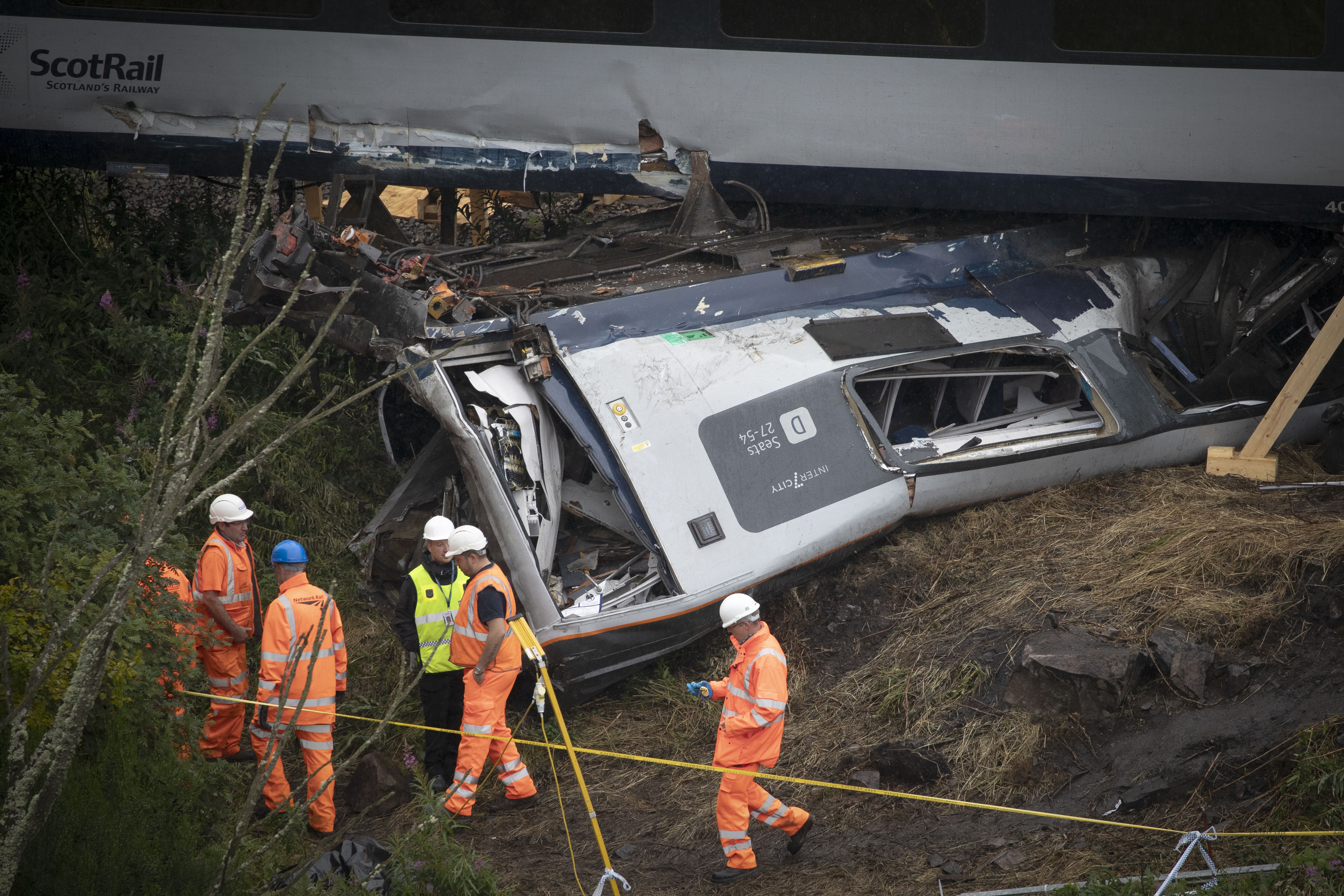 Investigators continue to work at the scene near Stonehaven, Aberdeenshire, following the derailment of the ScotRail train (PA)