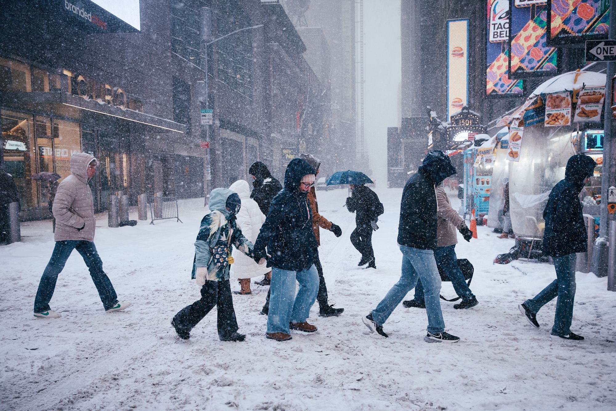 People cross the street after a snowstorm in New York City this past weekend. The U.S. finally has some good news this flu season