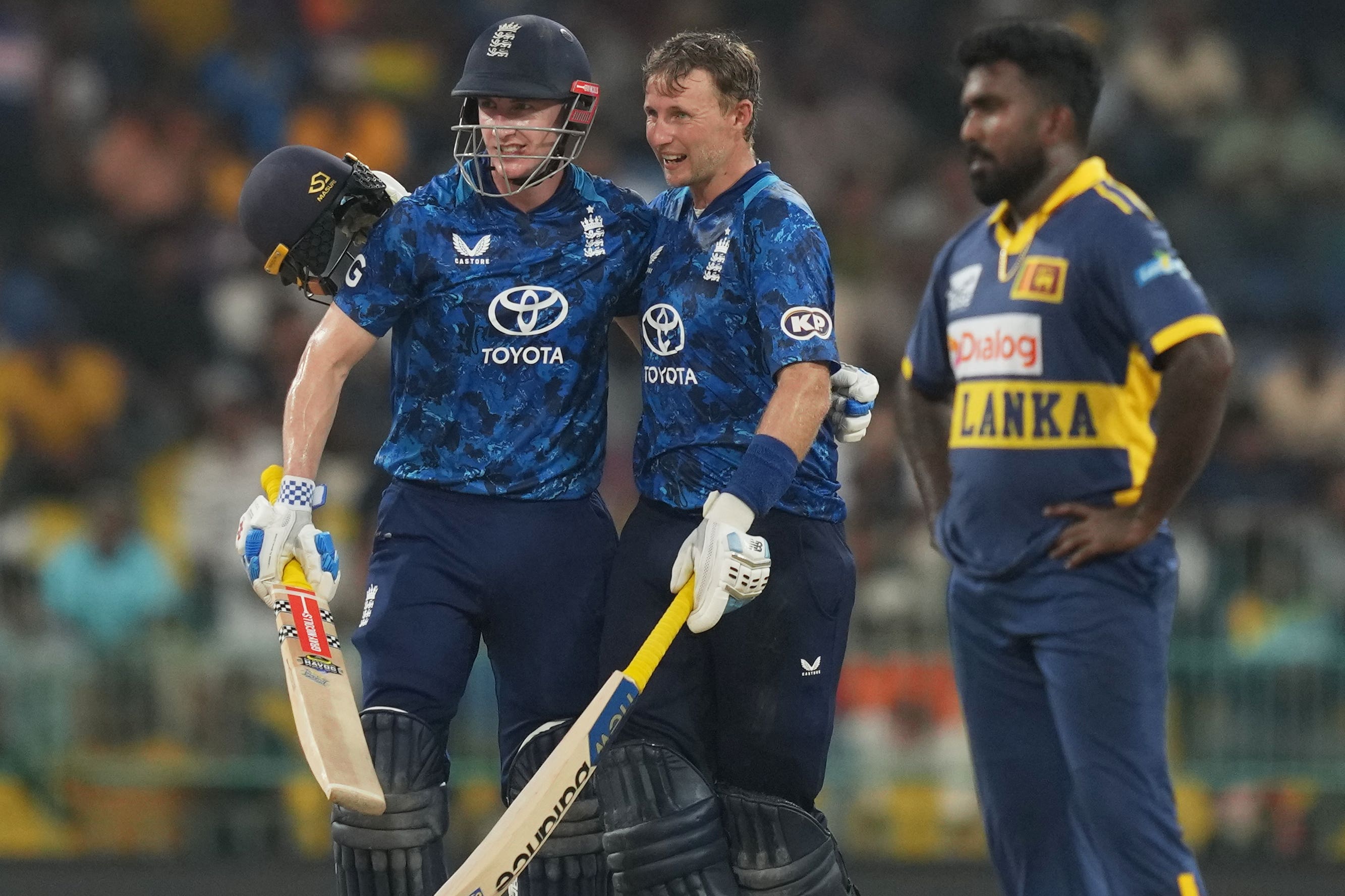 Harry Brook, left, copied Stone Cold Steve Austin’s ‘beer smash’ celebration after scoring a century (Eranga Jayawardena/AP)