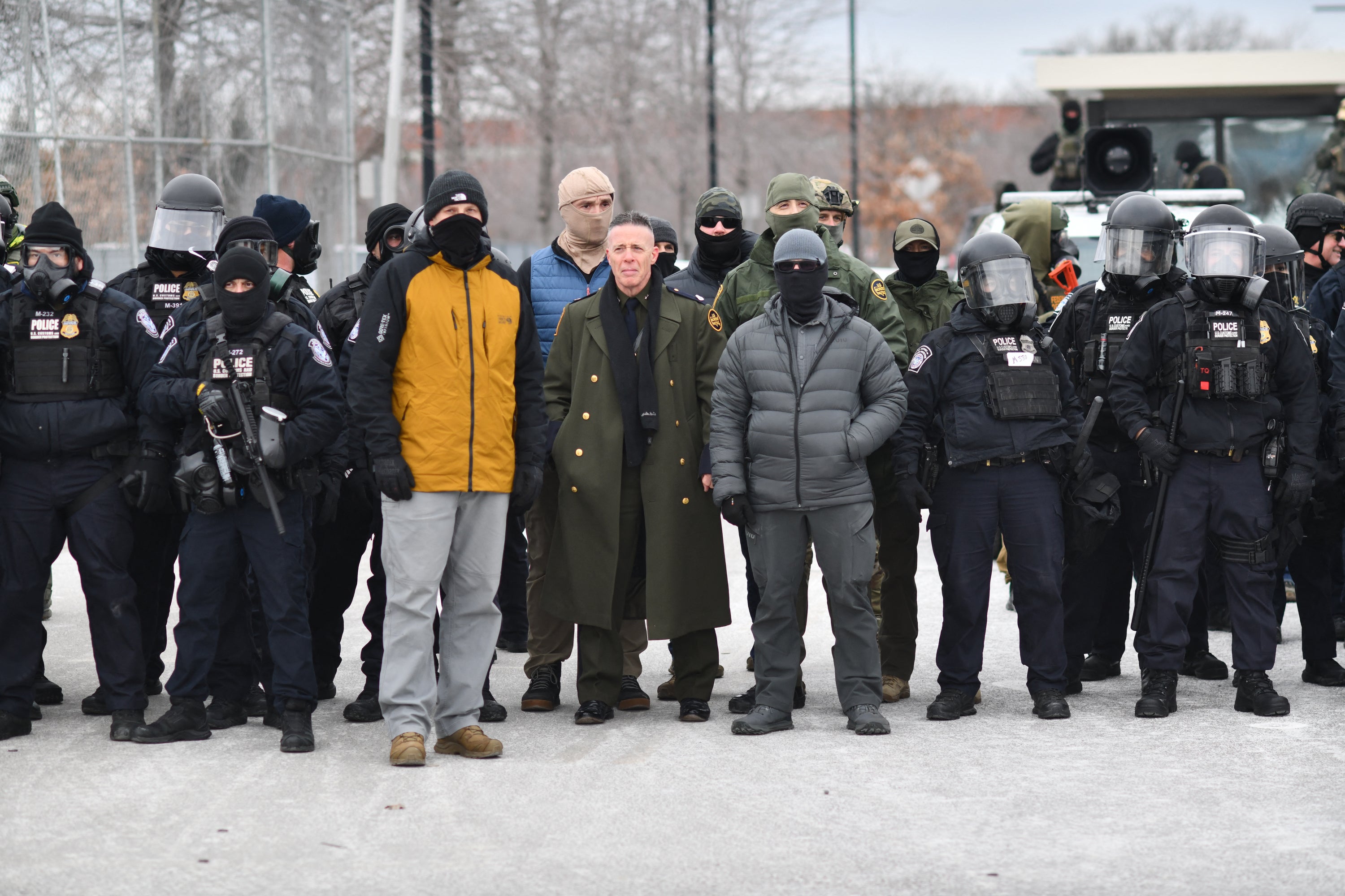 Bovino flanked by fellow federal agents during a protest against ICE outside the Bishop Whipple Federal Building in Minneapolis, this month