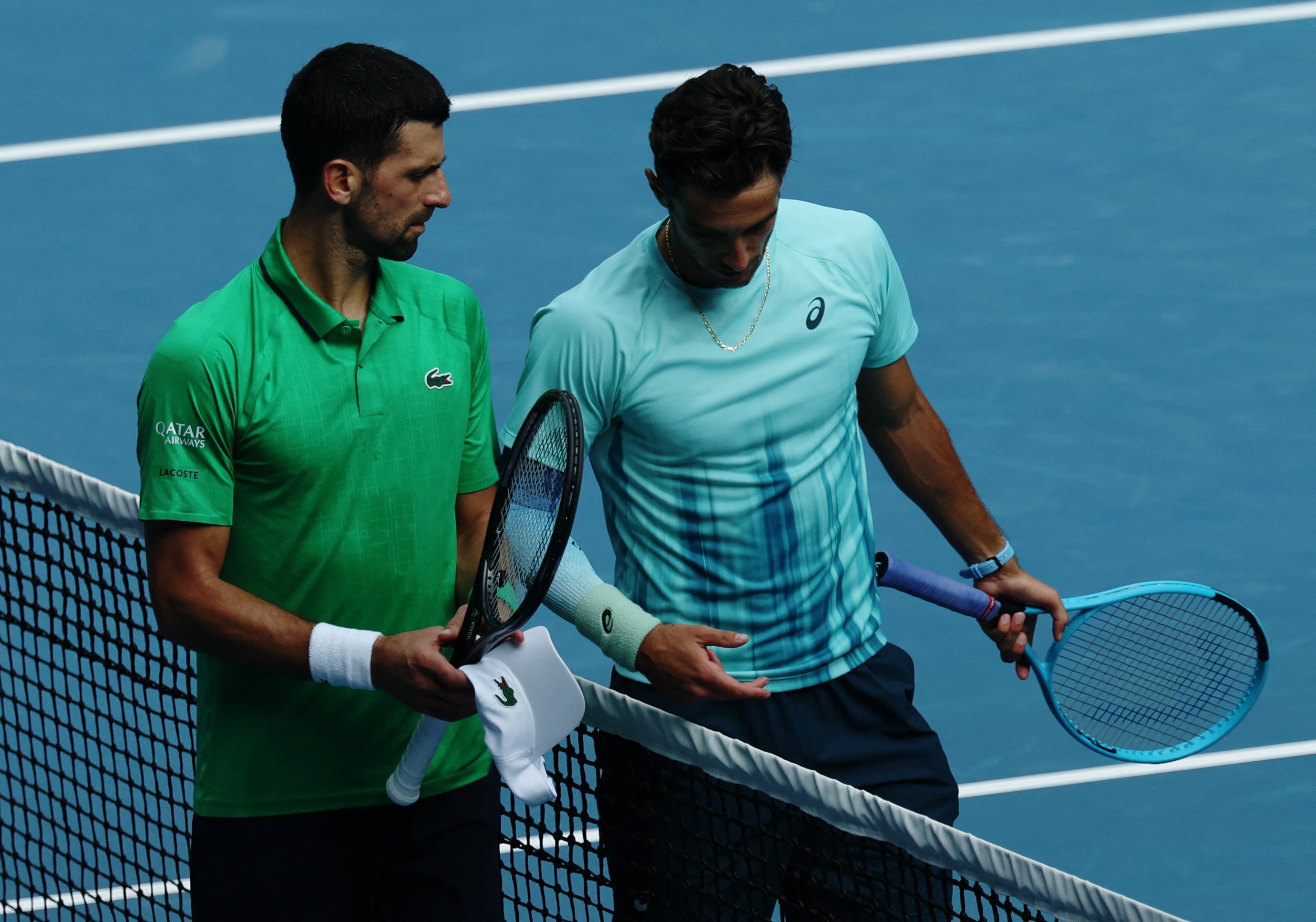 <p>Novak Djokovic reacts after Lorenzo Musetti retires from their Australian Open semi-final </p>