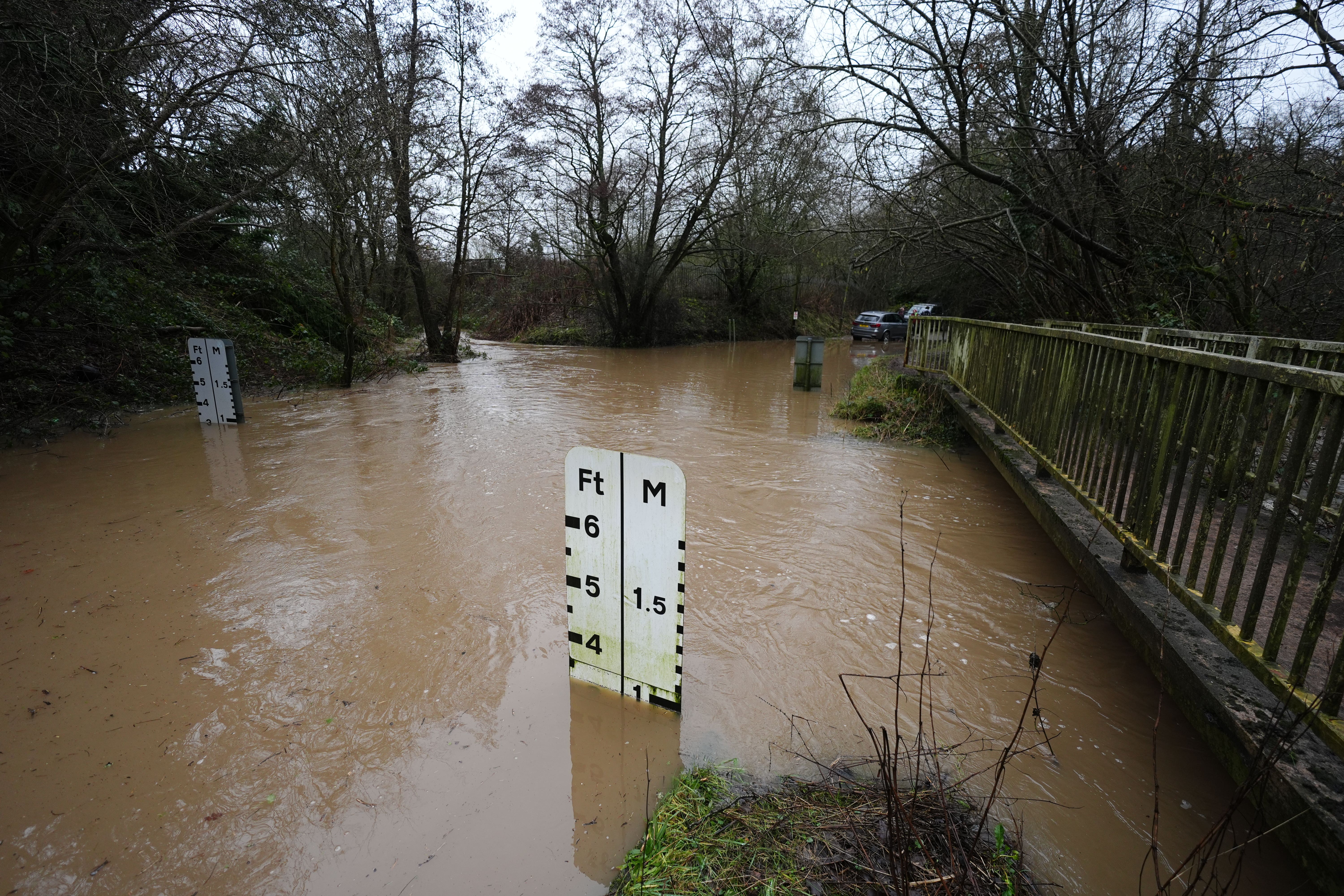 A river ford under several feet of water at Houndsfield Lane in Birmingham on Tuesday (Jacob King/PA)