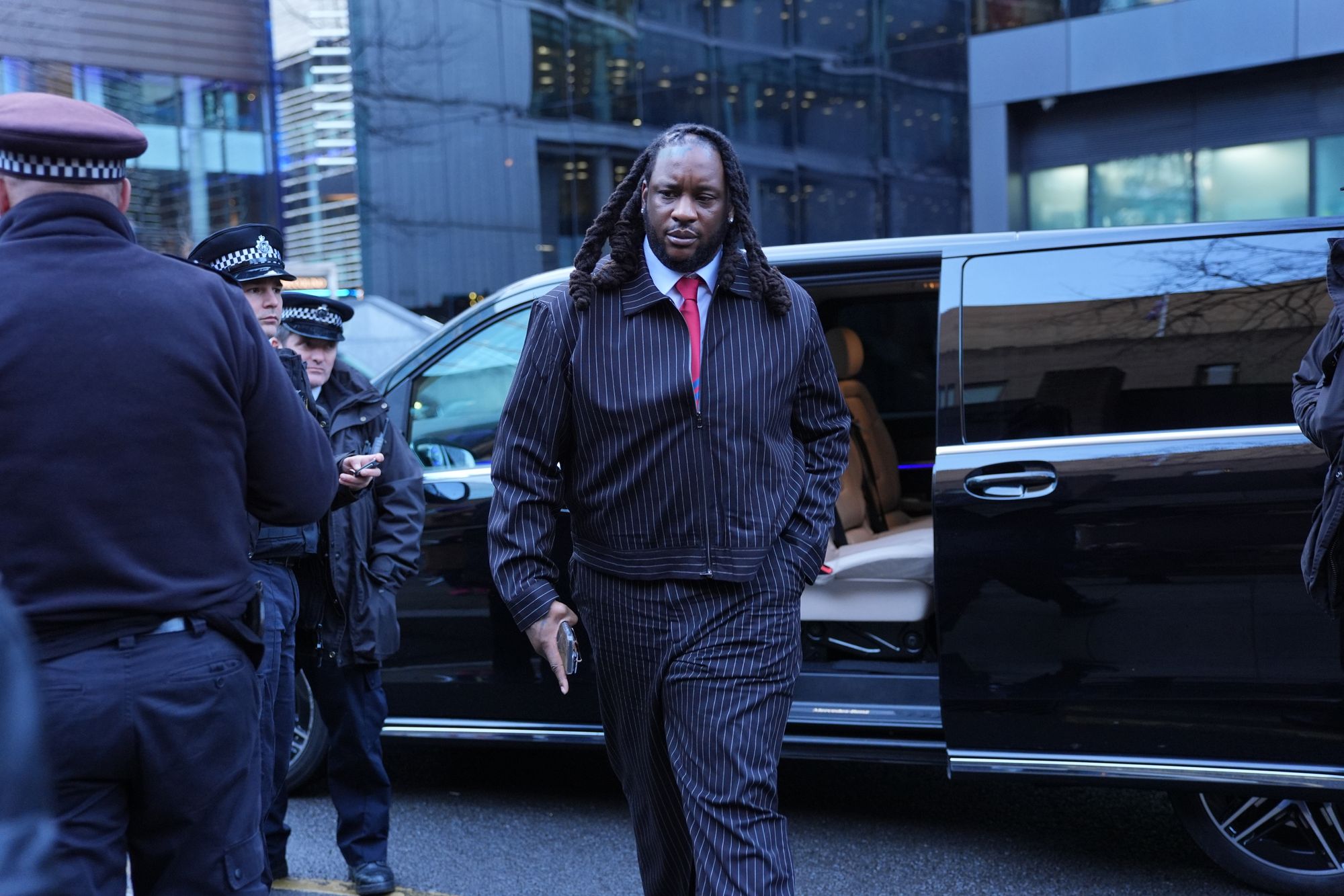 Omololu Akinlolu arriving at Southwark Crown Court