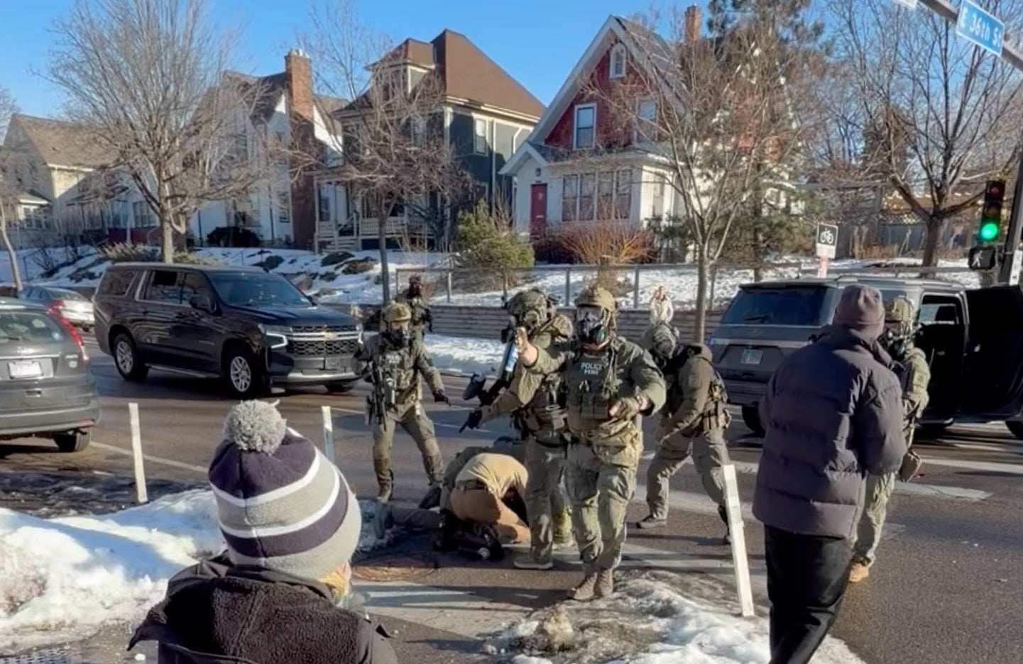 An image taken from a video shows Alex Pretti (centre left) scuffling with federal immigration officers on 13 January