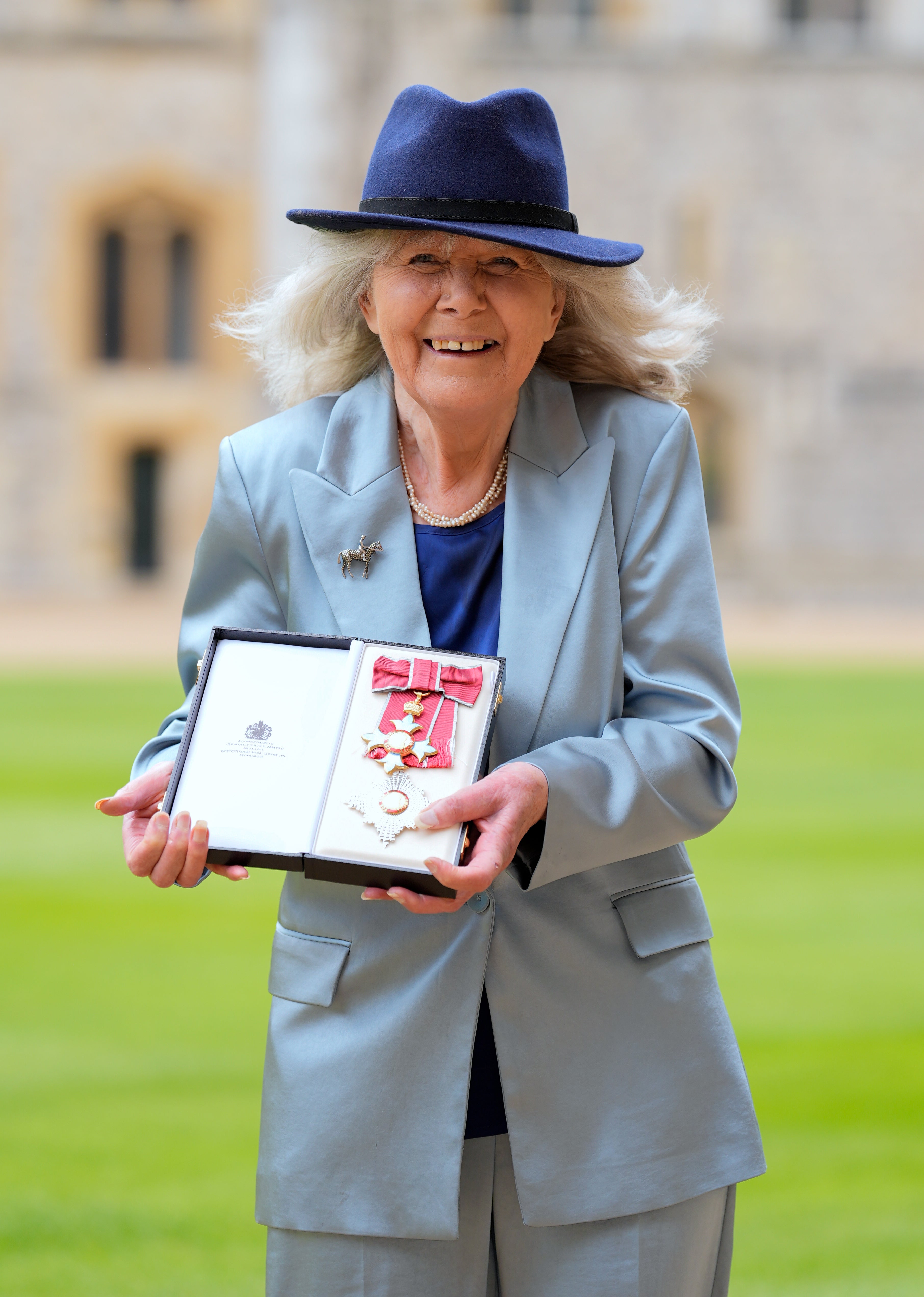 Dame Jilly Cooper after being made a Dame Commander of the British Empire by the King at Windsor Castle (Andrew Matthews/PA)