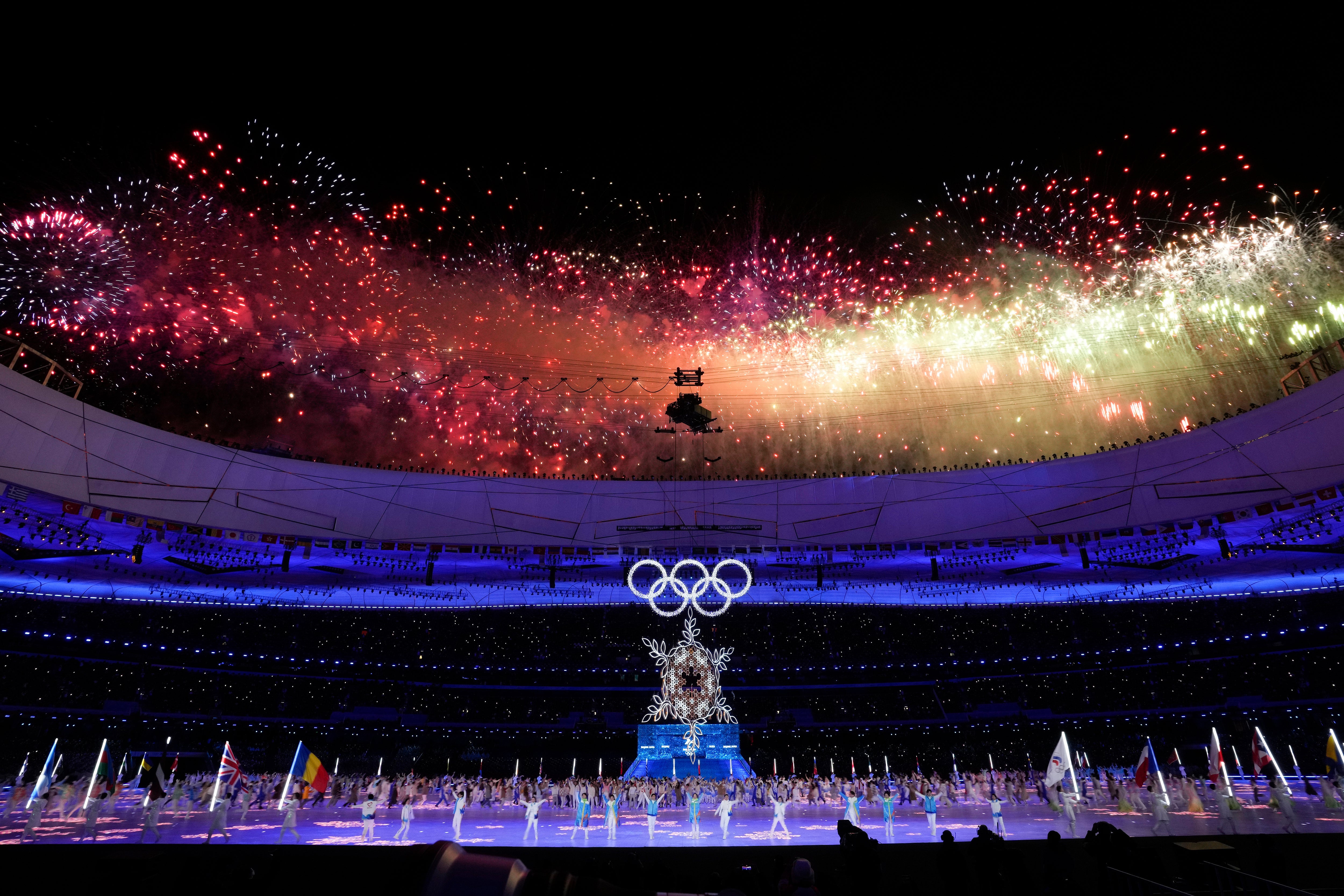 Fireworks explode during the 2022 Winter Olympic Games closing ceremony in Sochi