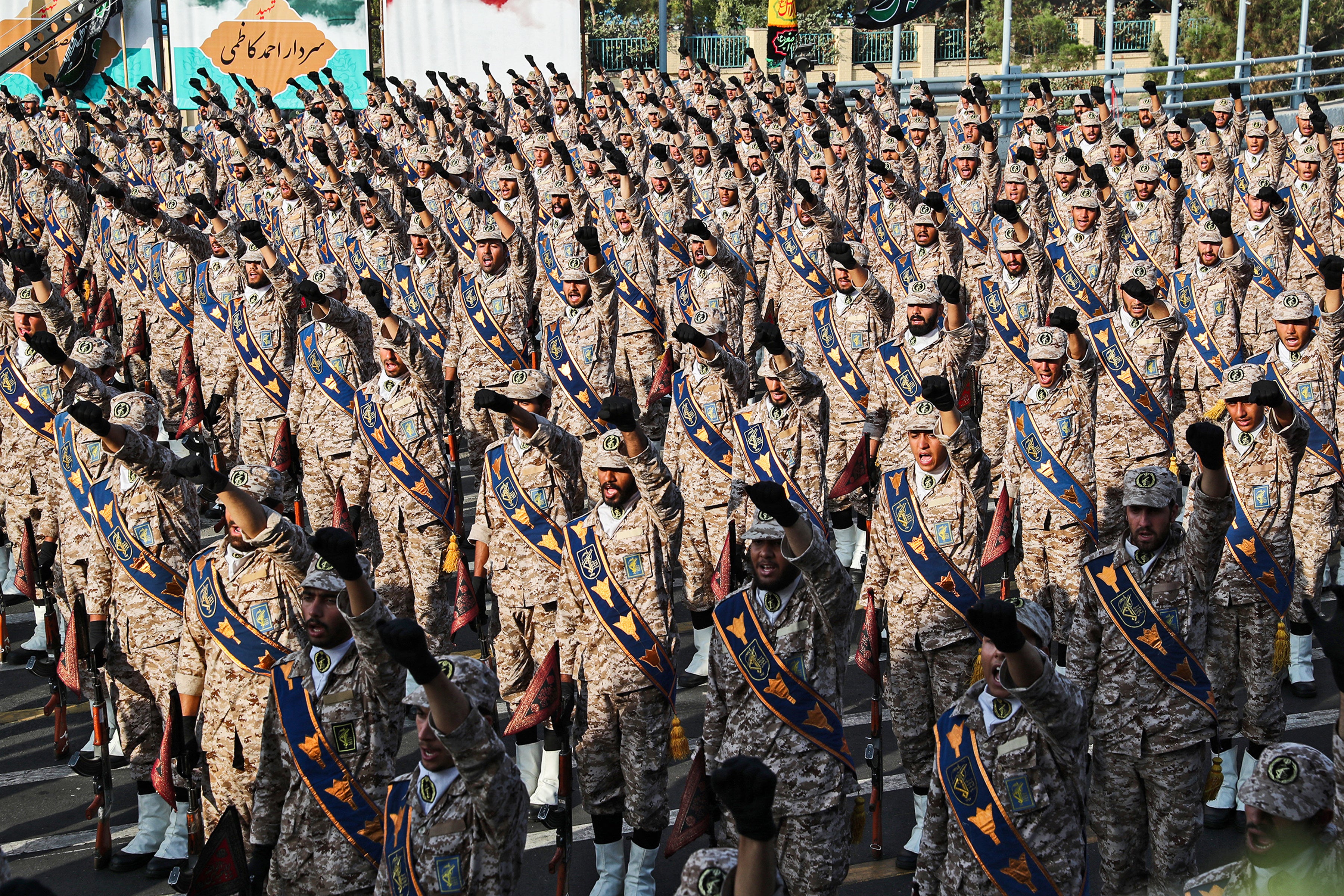 Members of Iran's Islamic Revolutionary Guard Corps (IRGC) giving a military salute during a military parade in Tehran