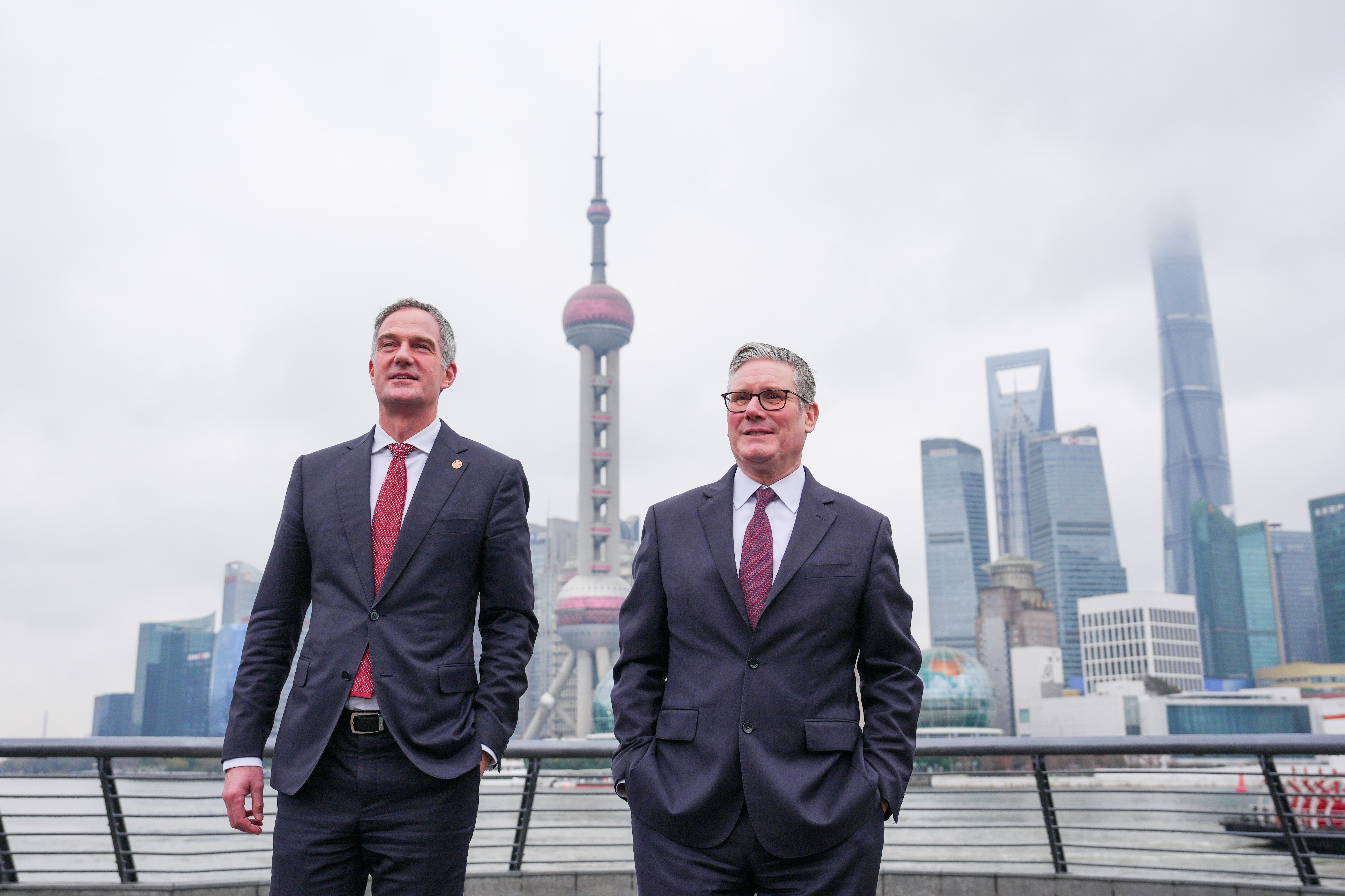 Prime Minister Sir Keir Starmer (right) walks the Shanghai Bund with Business and Trade Secretary Peter Kyle