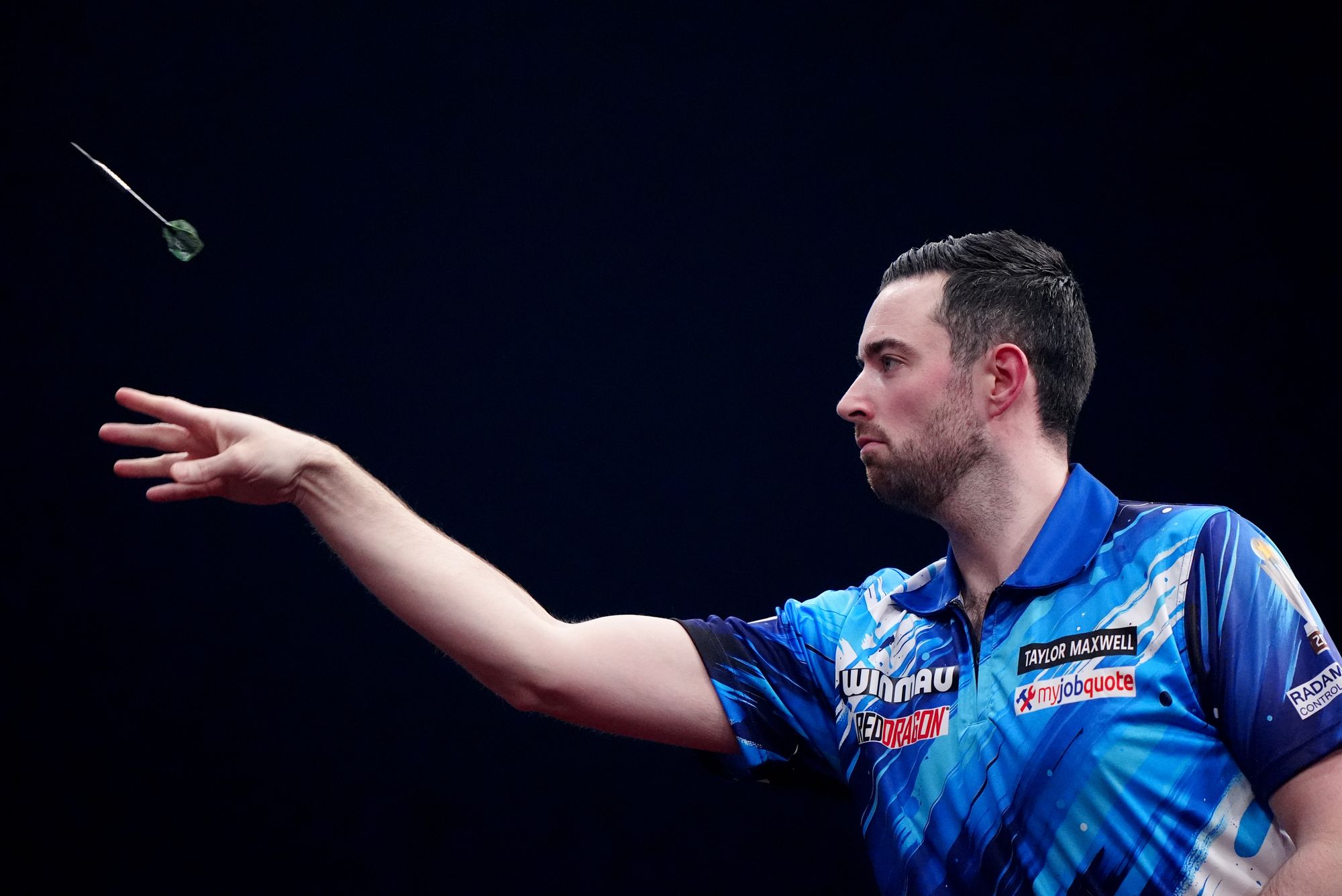 Luke Humphries hit a nine-darter as he battled his way past Luke Woodhouse