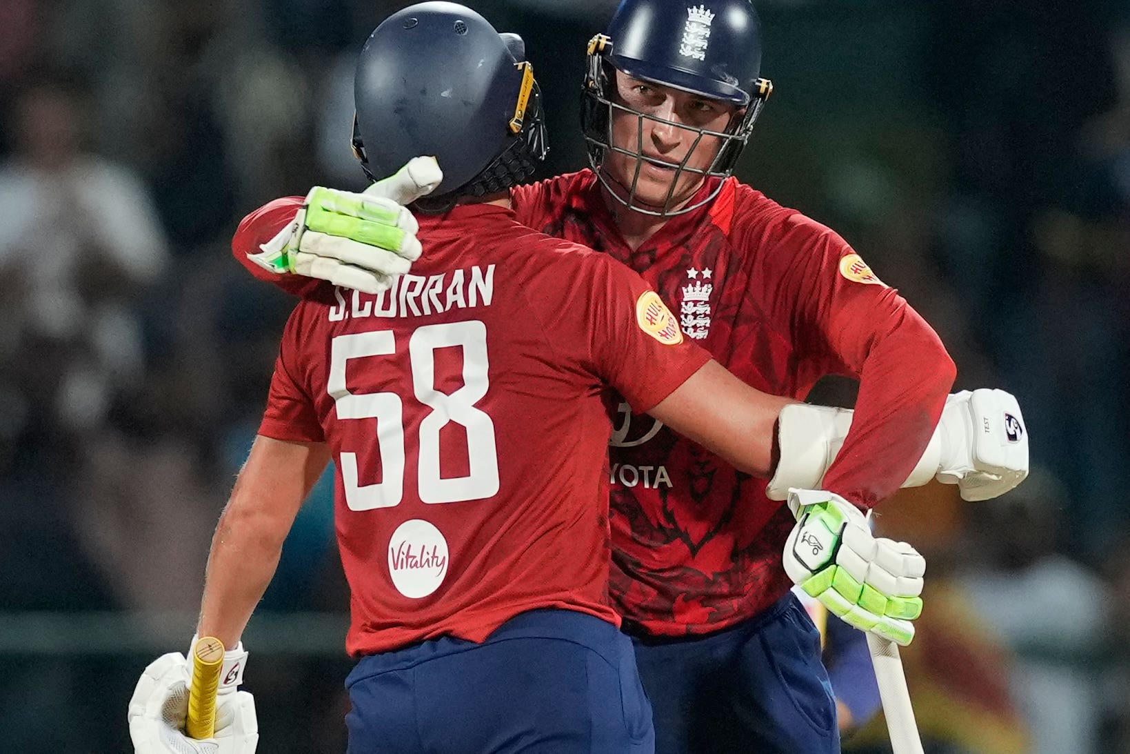 Tom Banton, right, and England’s Sam Curran celebrate after seeing England to victory (AP Photo/Eranga Jayawardena)