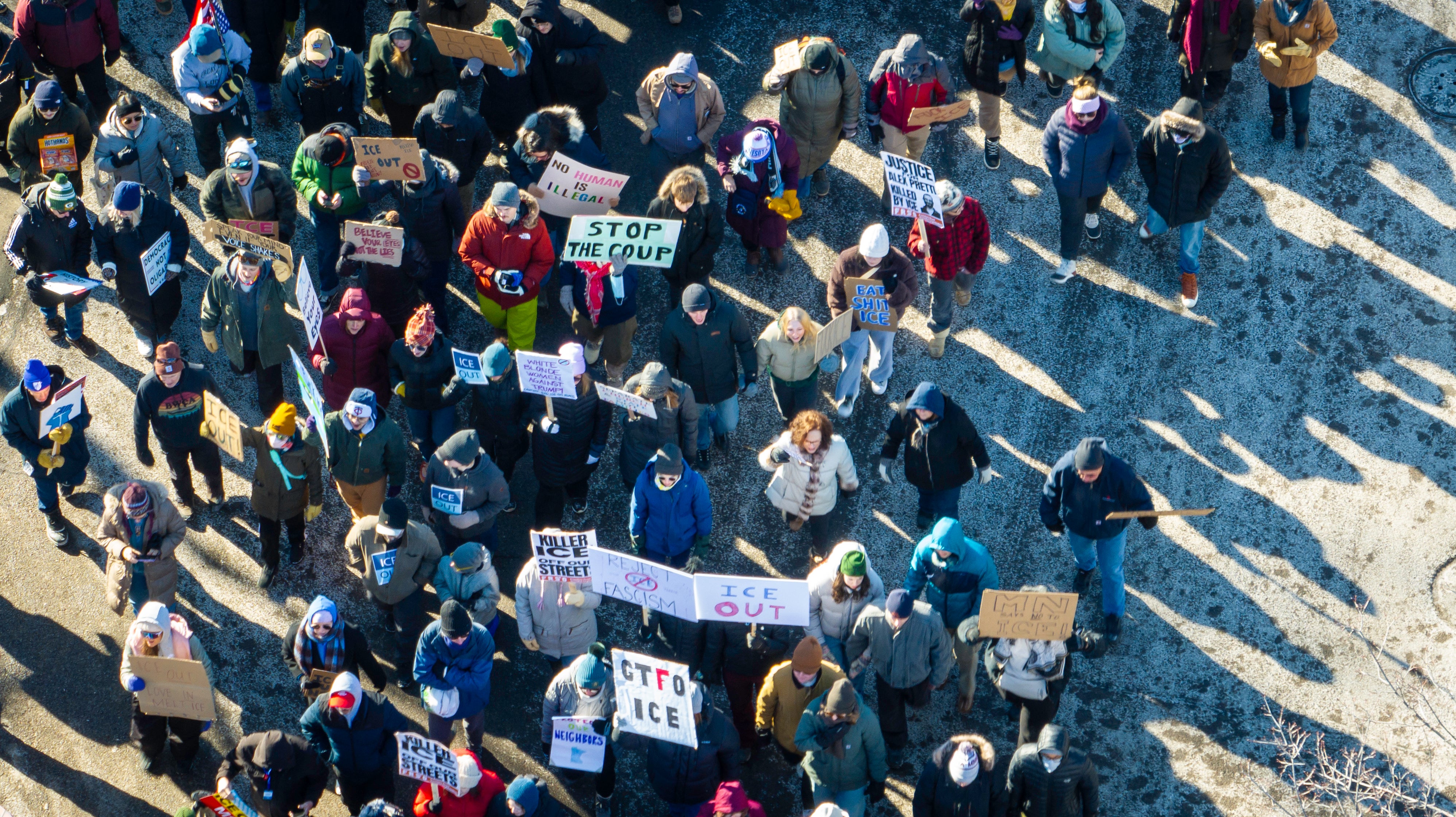 Some protestors held signs calling for ICE to withdraw from the city