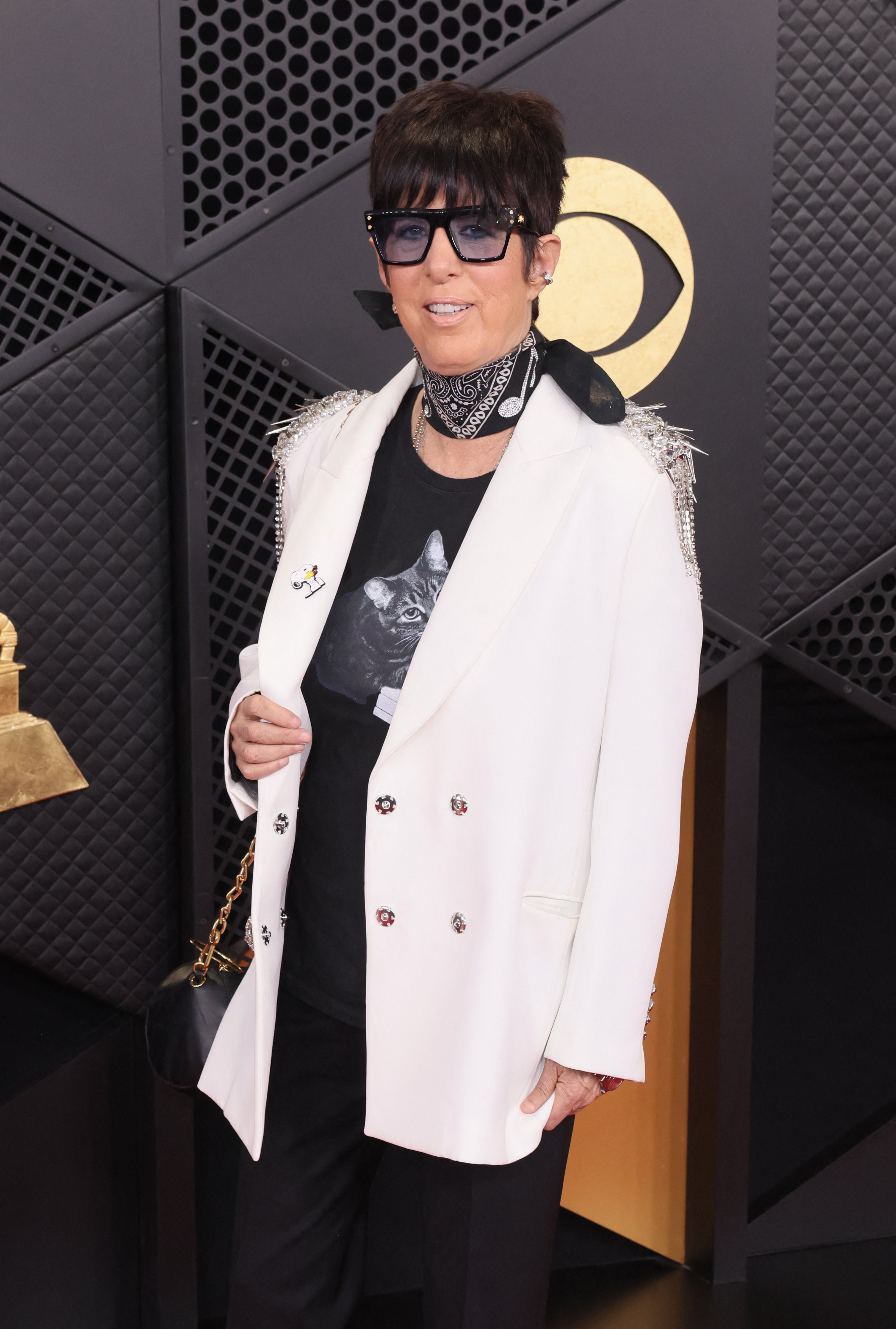 The ensemble also featured a white blazer and a black bandana with music notes on it, in a nod to the evening