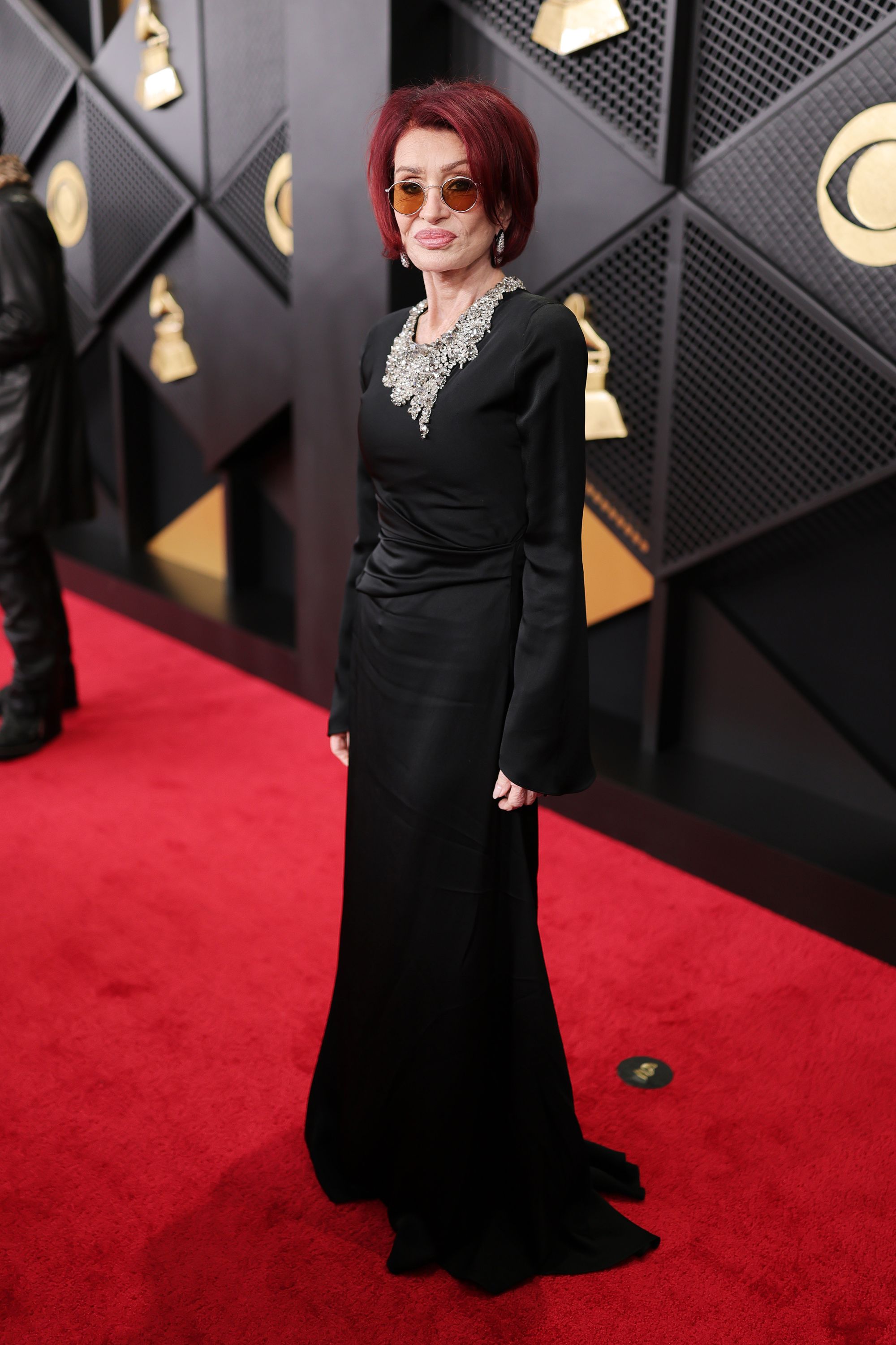 Sharon Osbourne looked classy in black, wearing a floor length gown with a silver bejeweled neckline