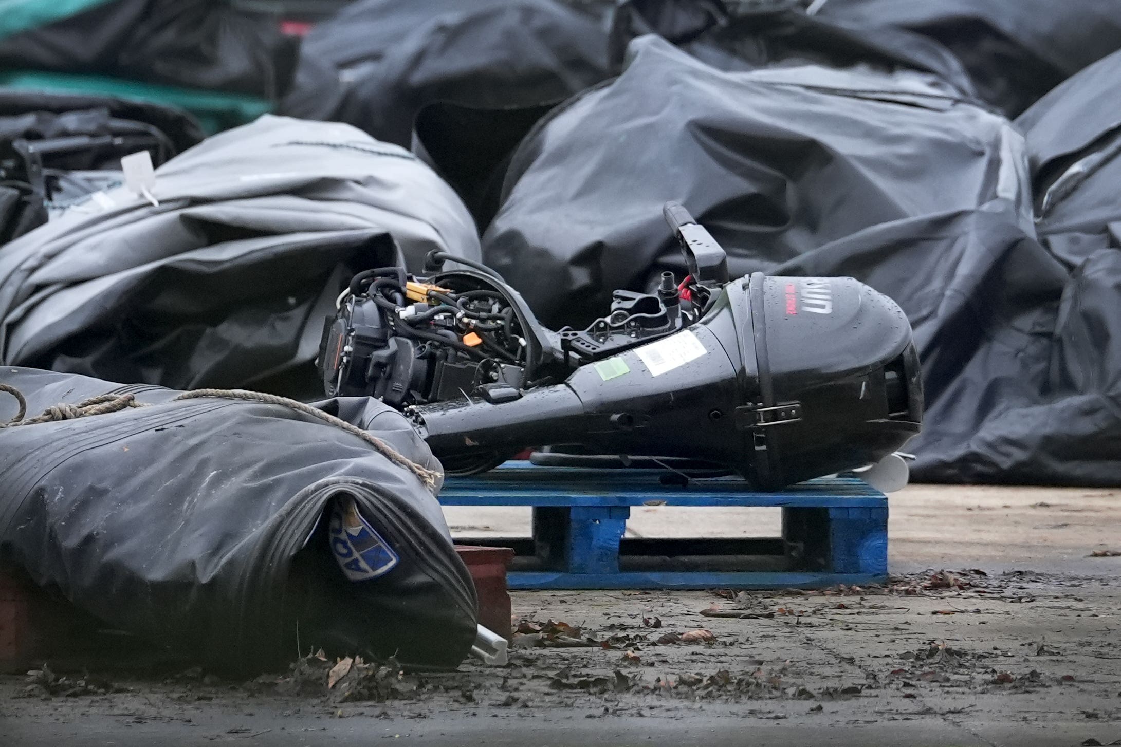 Small boats and outboard motors used by suspected migrants at a warehouse facility in Dover (Gareth Fuller/PA)