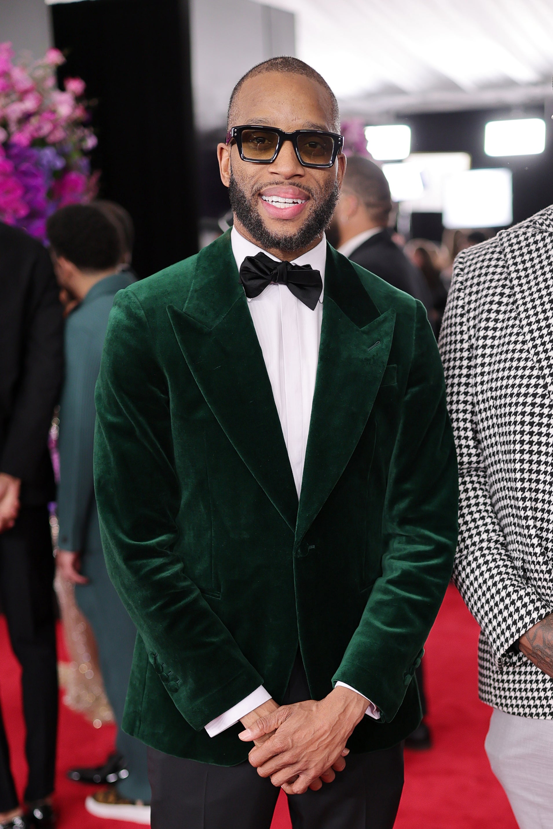 Trombone Shorty offered a pop of color and flare on the red carpet, wearing a green velvet jacket and black bowtie