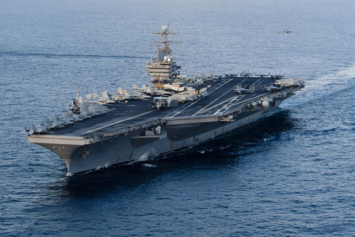 US military shoots down Iranian drone ‘aggressively approaching’ aircraft carrier