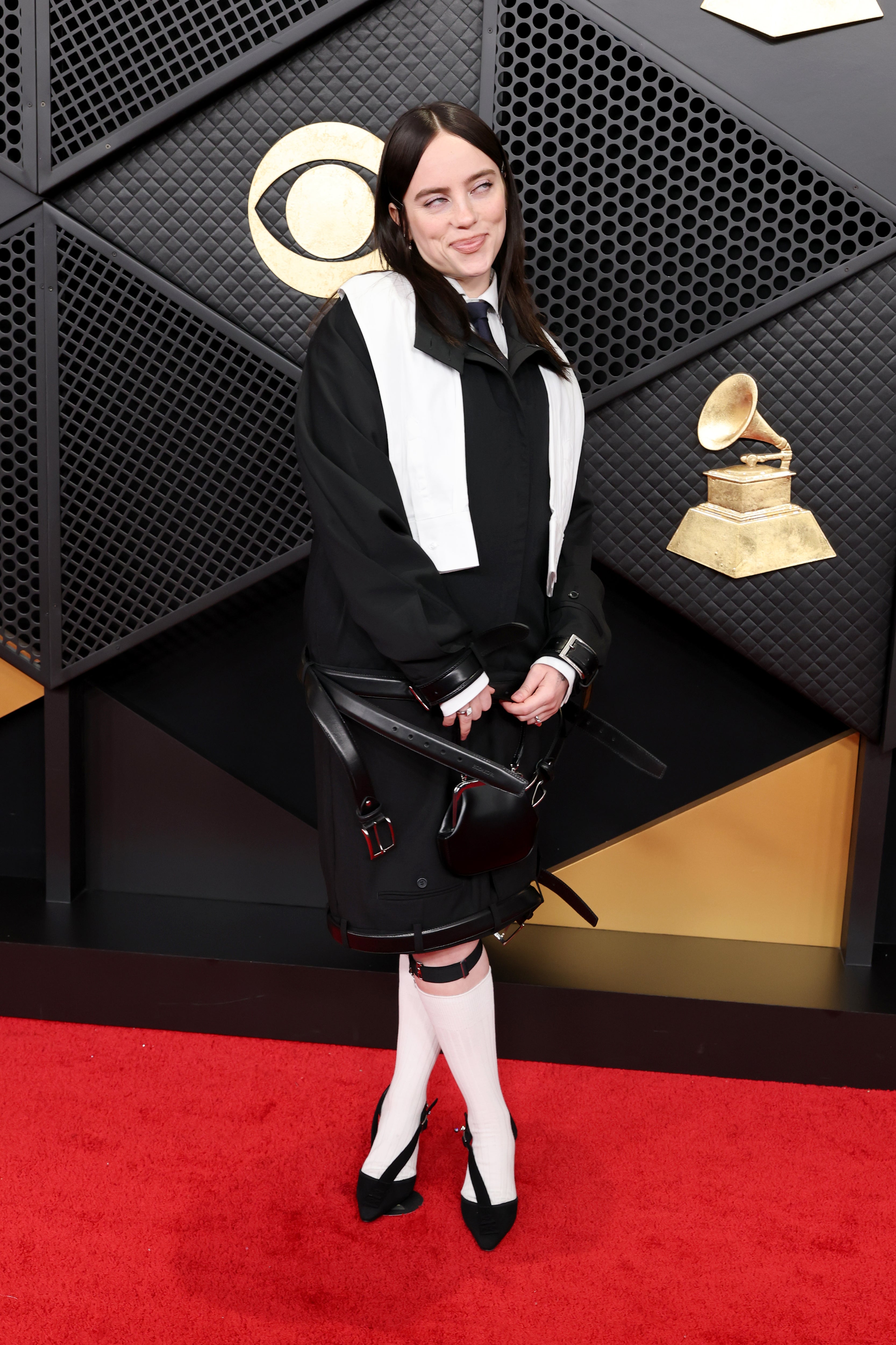 She also opted for black shorts, pointed heels, and classic white knee-high socks